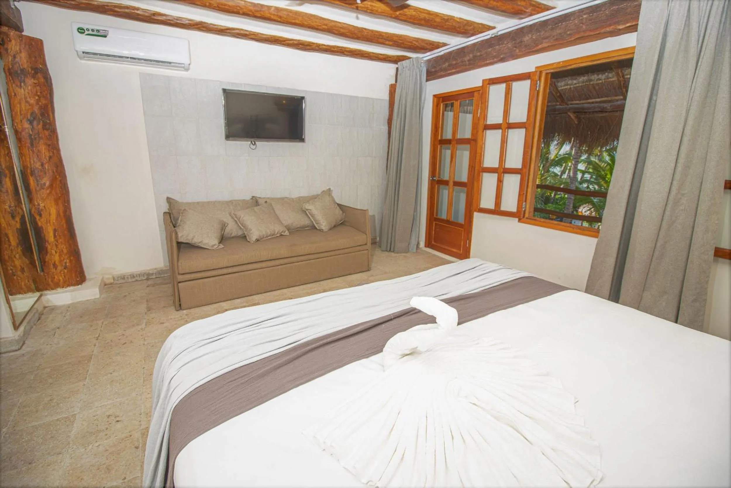 Photo of the whole room, Bed in Amaite Holbox - Oceanfront Hotel