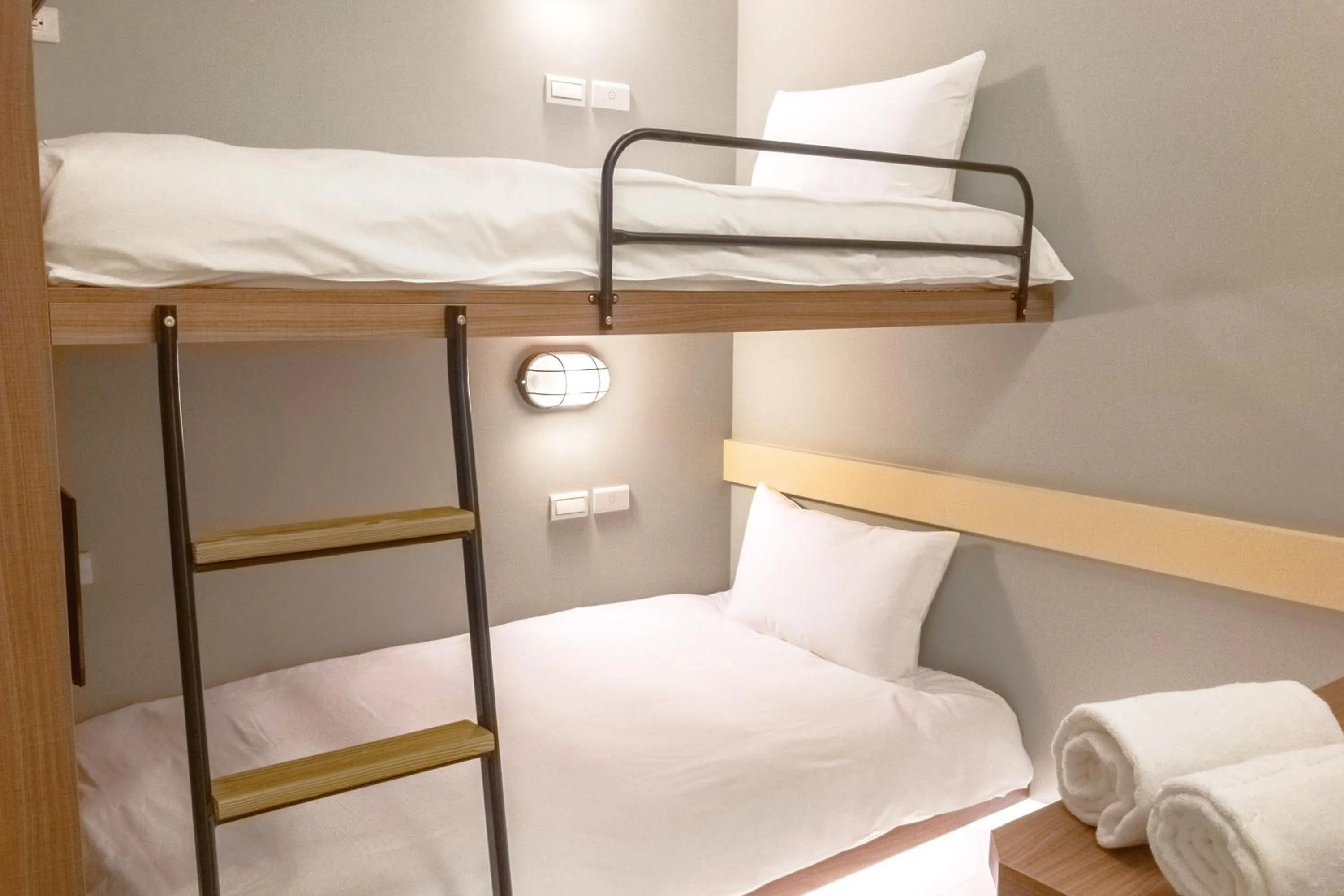 Bed in Divecube Hotel