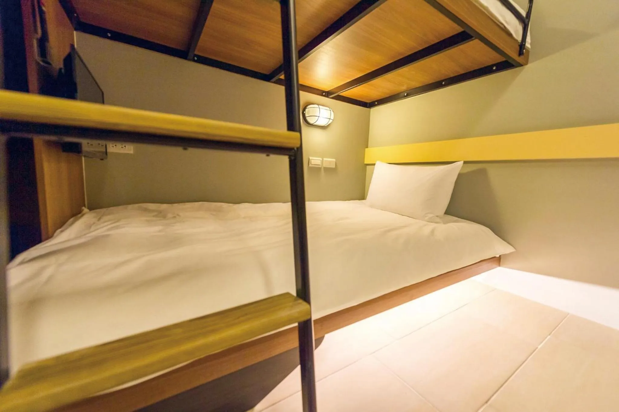 Bed in Divecube Hotel