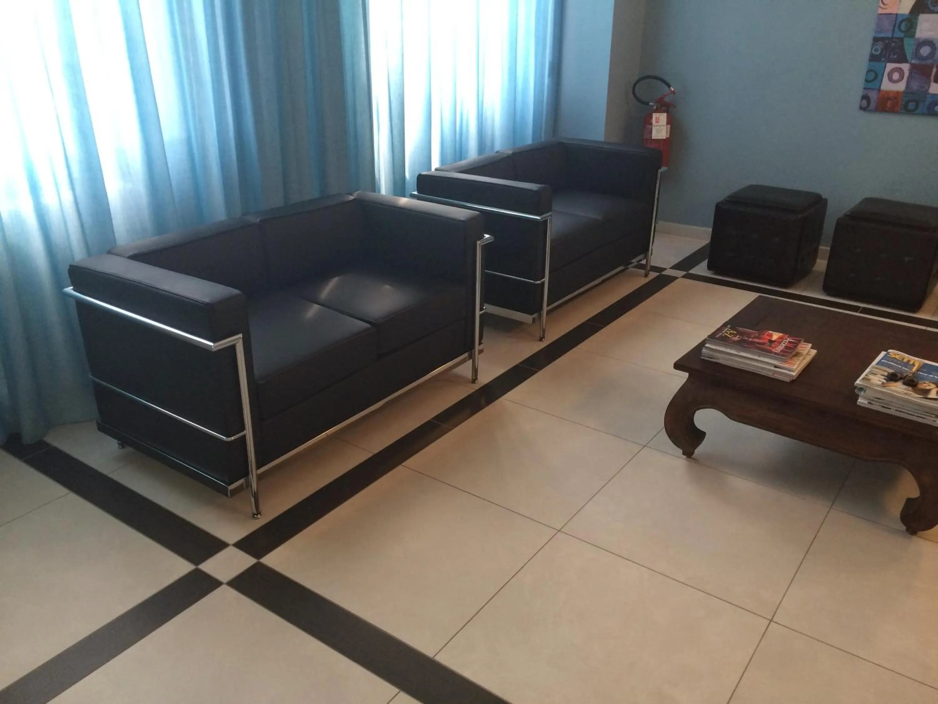 Communal lounge/ TV room in Hotel Arcobaleno