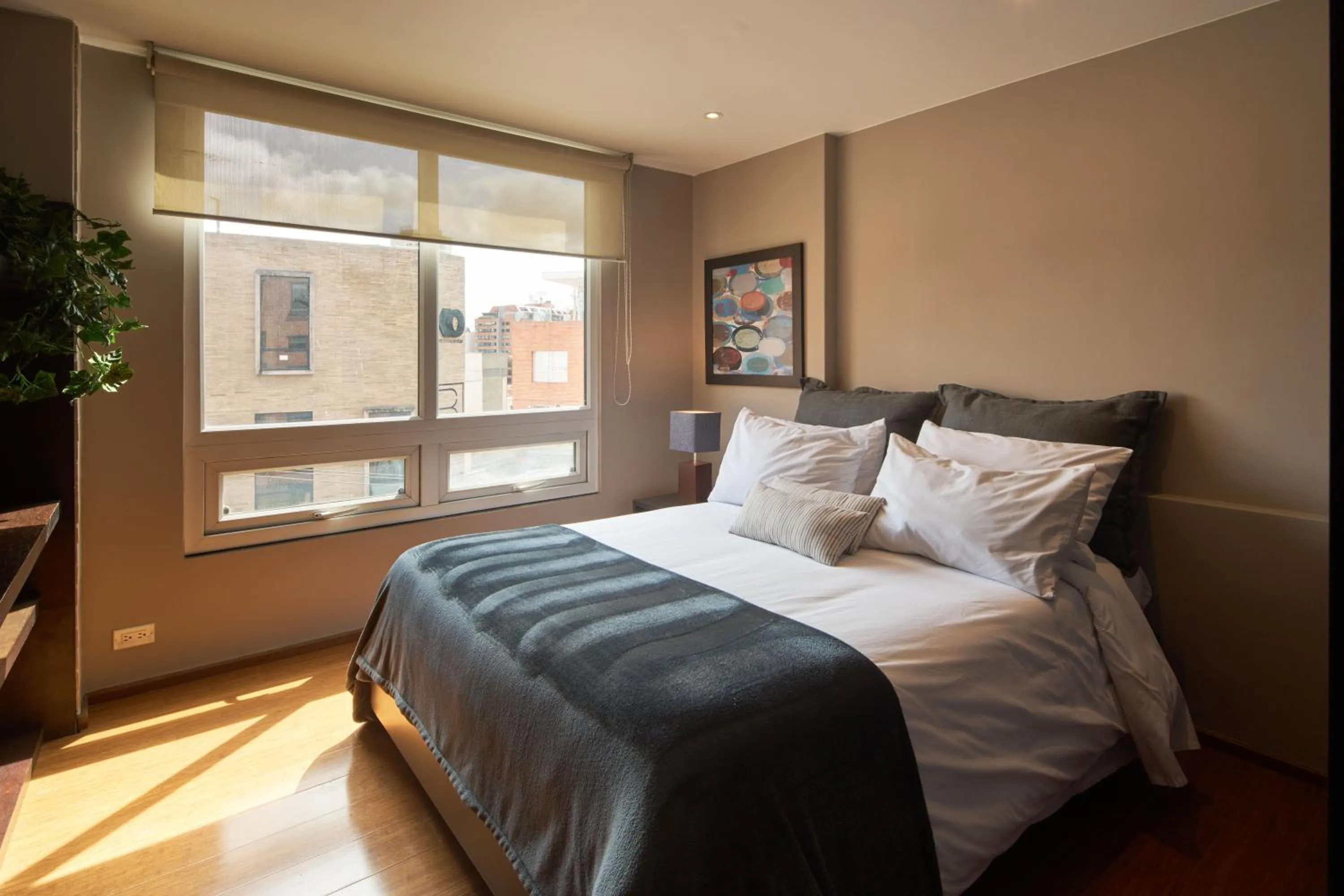 Bed in Nico Apartasuites