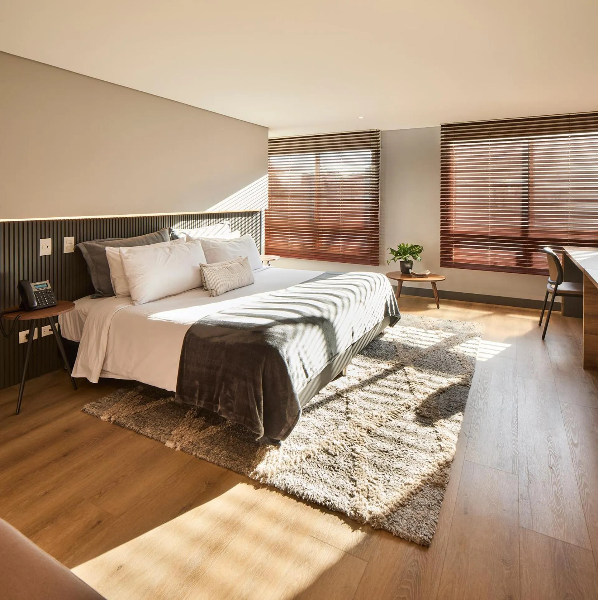 Bed in Nico Apartasuites