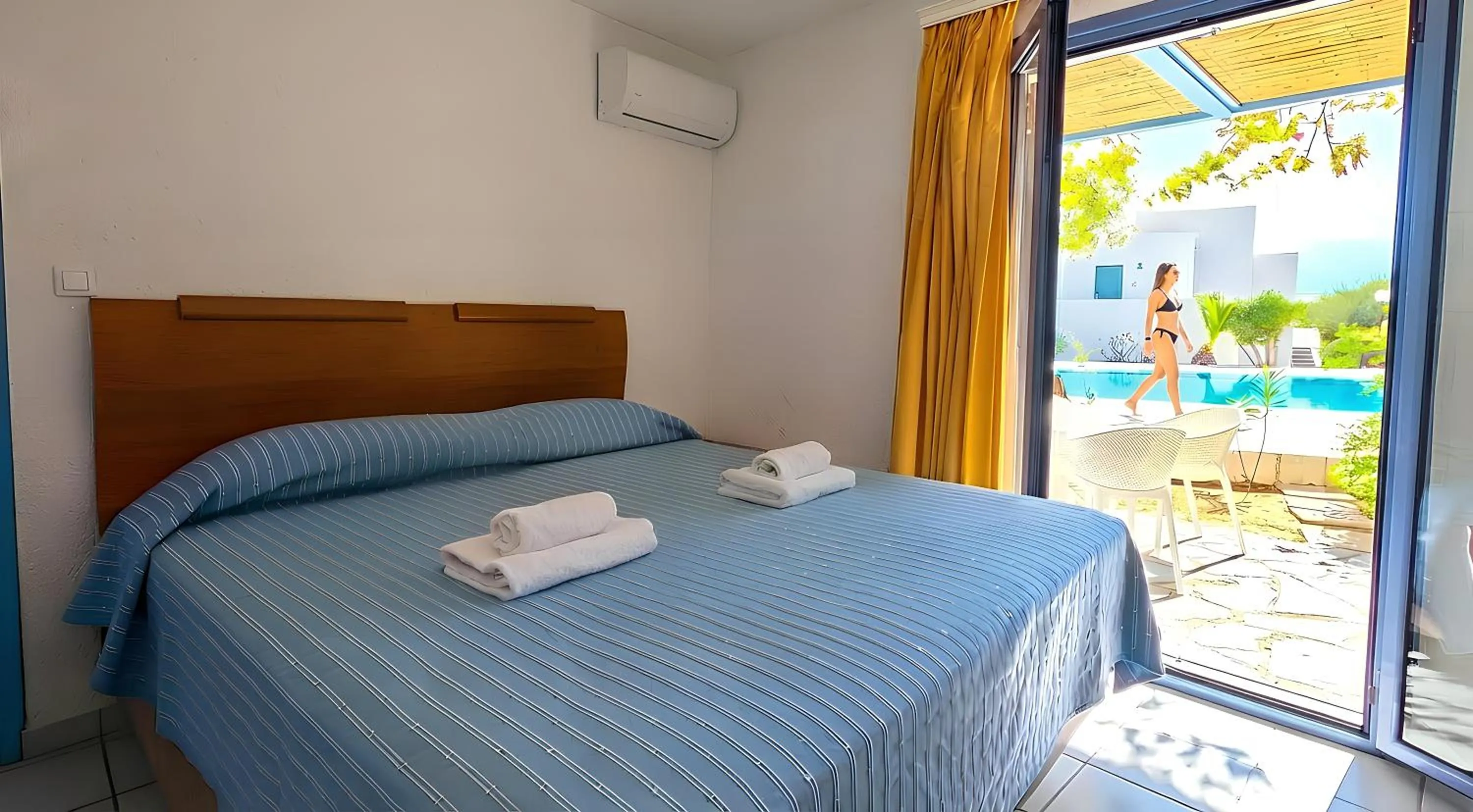Bed in Palatia Village Hotel Apartments