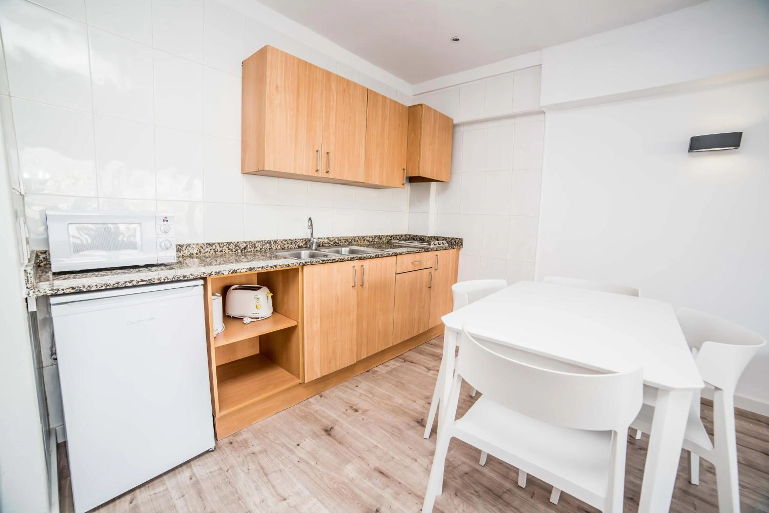 Kitchen or kitchenette in Pierre & Vacances Mallorca Portofino