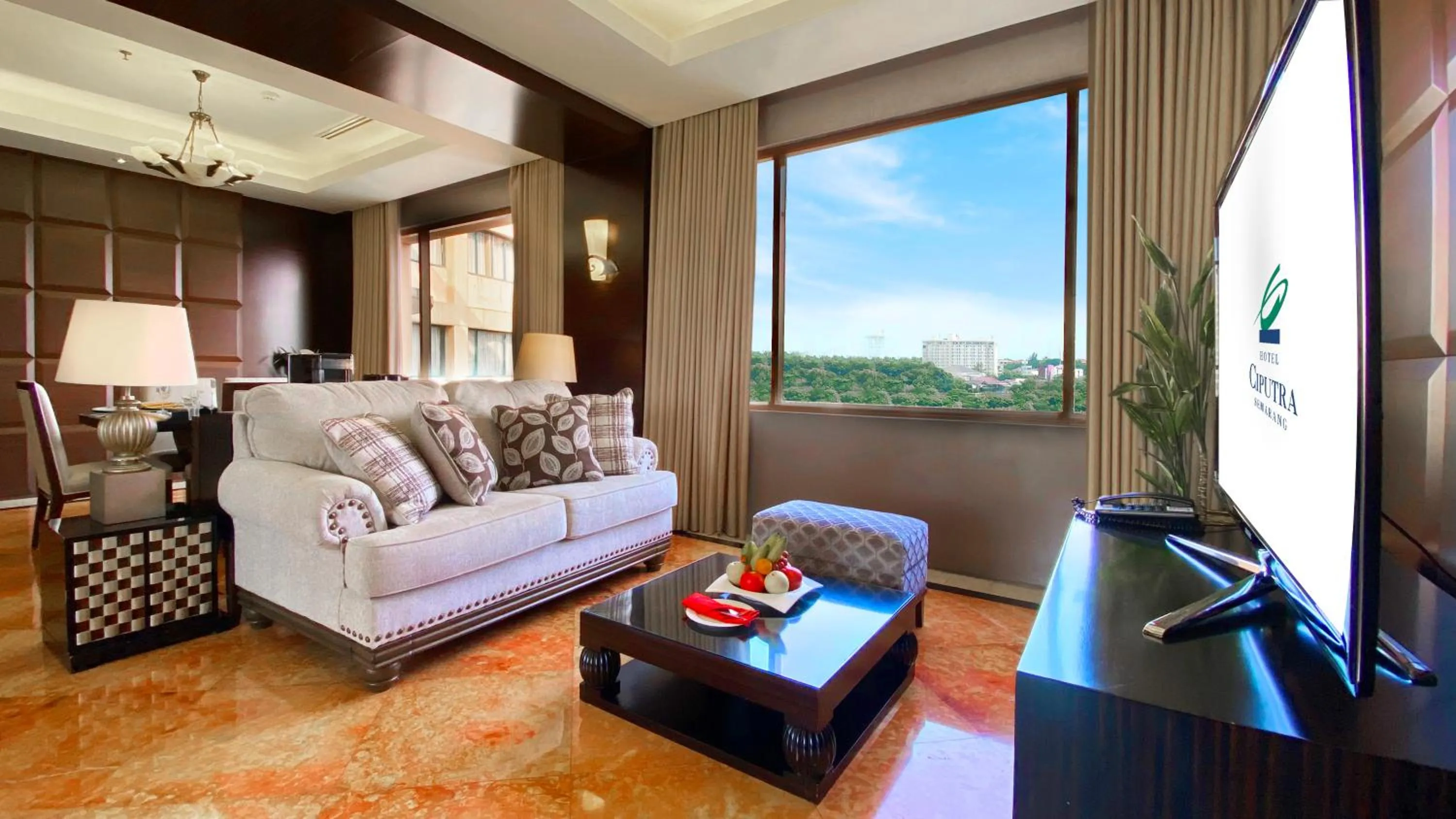 Living room in Hotel Ciputra Semarang managed by Swiss-Belhotel International