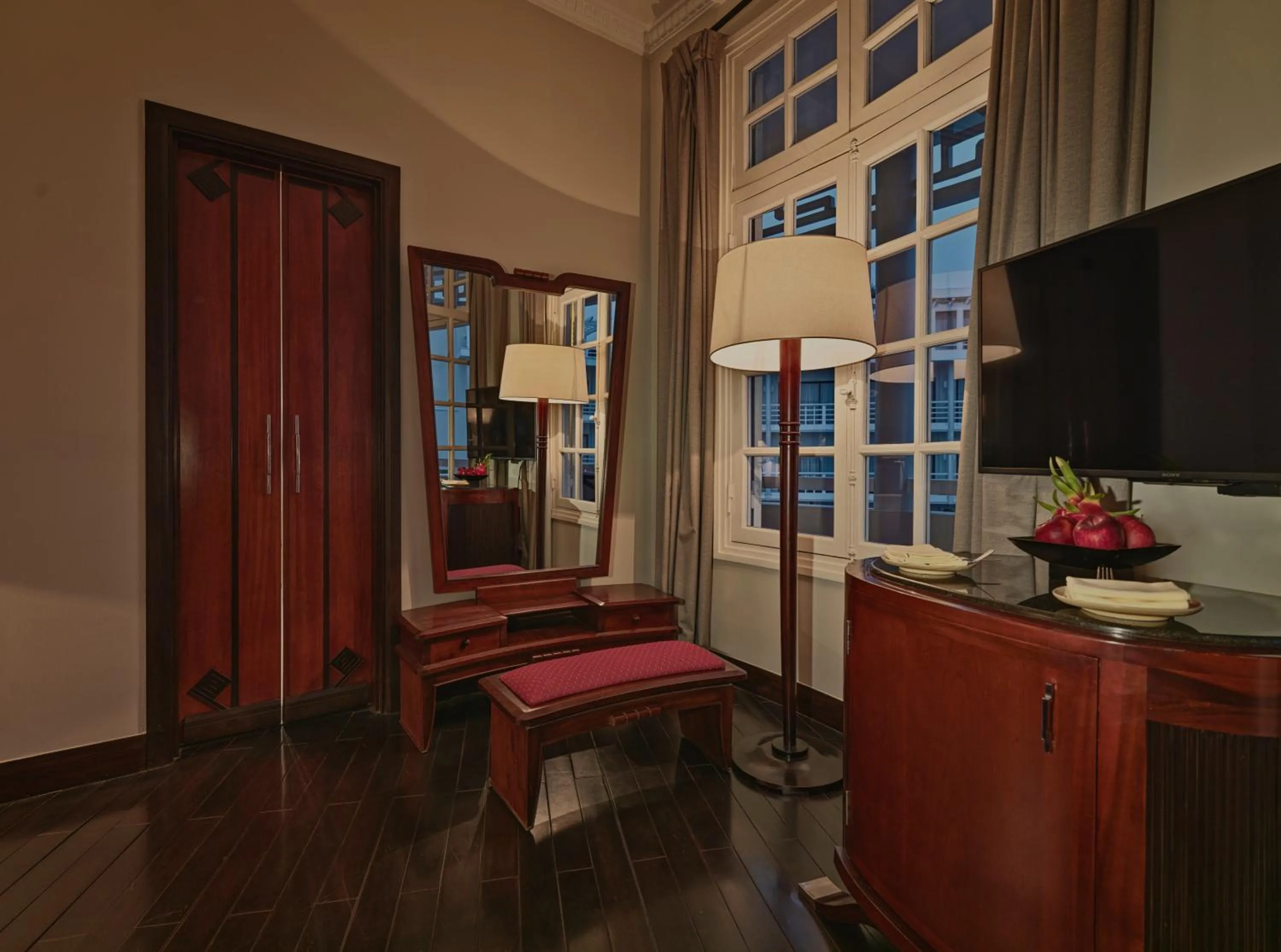 Communal lounge/ TV room in Azerai La Residence, Hue