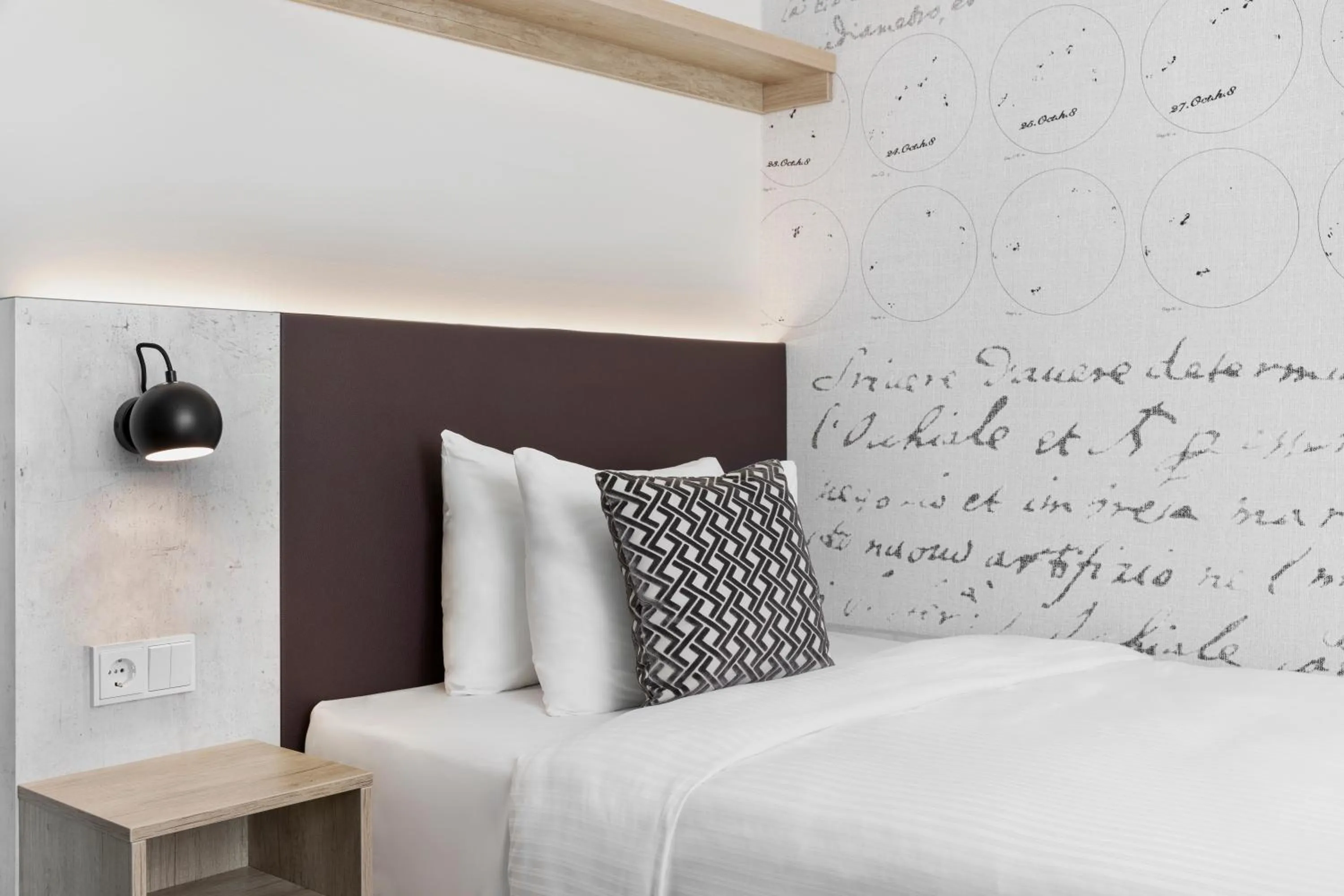 Bed in Stellaris Apartment Hotel