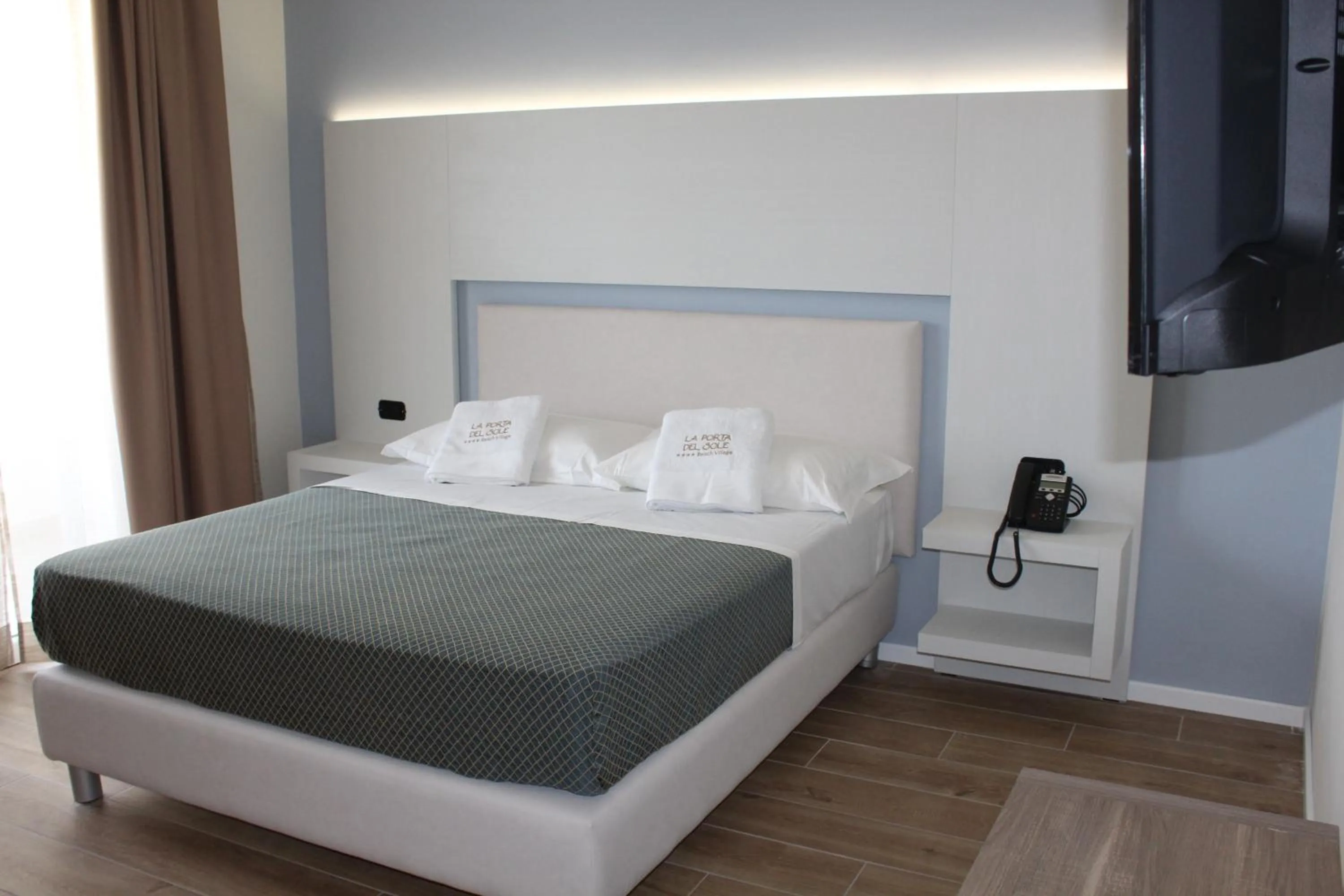 Bed in La Porta del Sole Hotel & Village