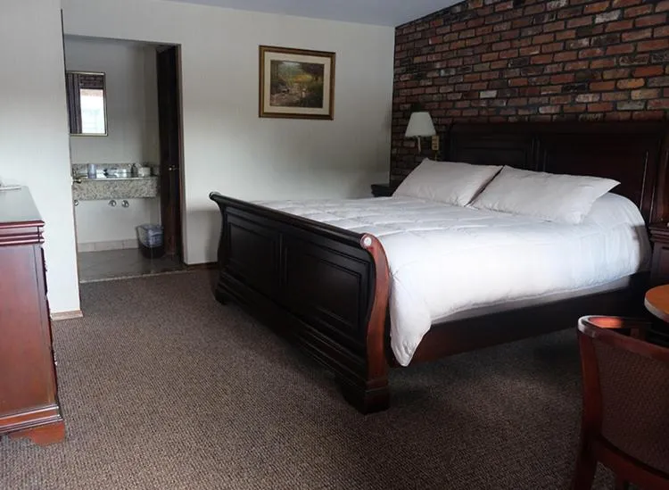 Bed in Chalet Inn & Suites