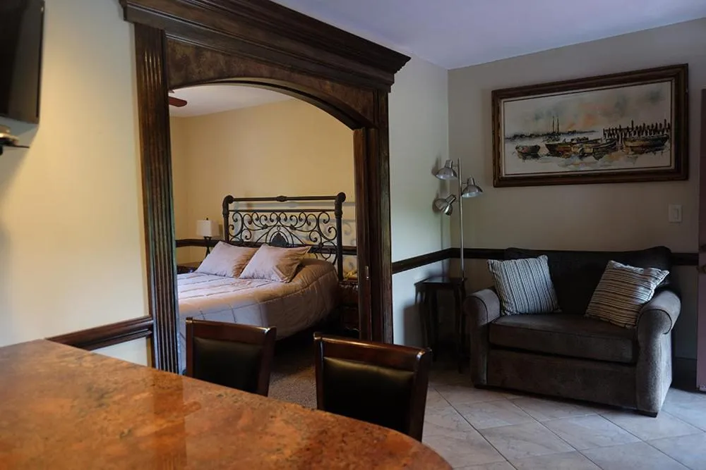 Bed in Chalet Inn & Suites