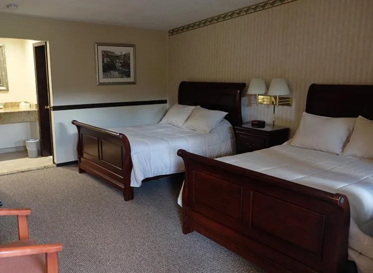 Bed in Chalet Inn & Suites