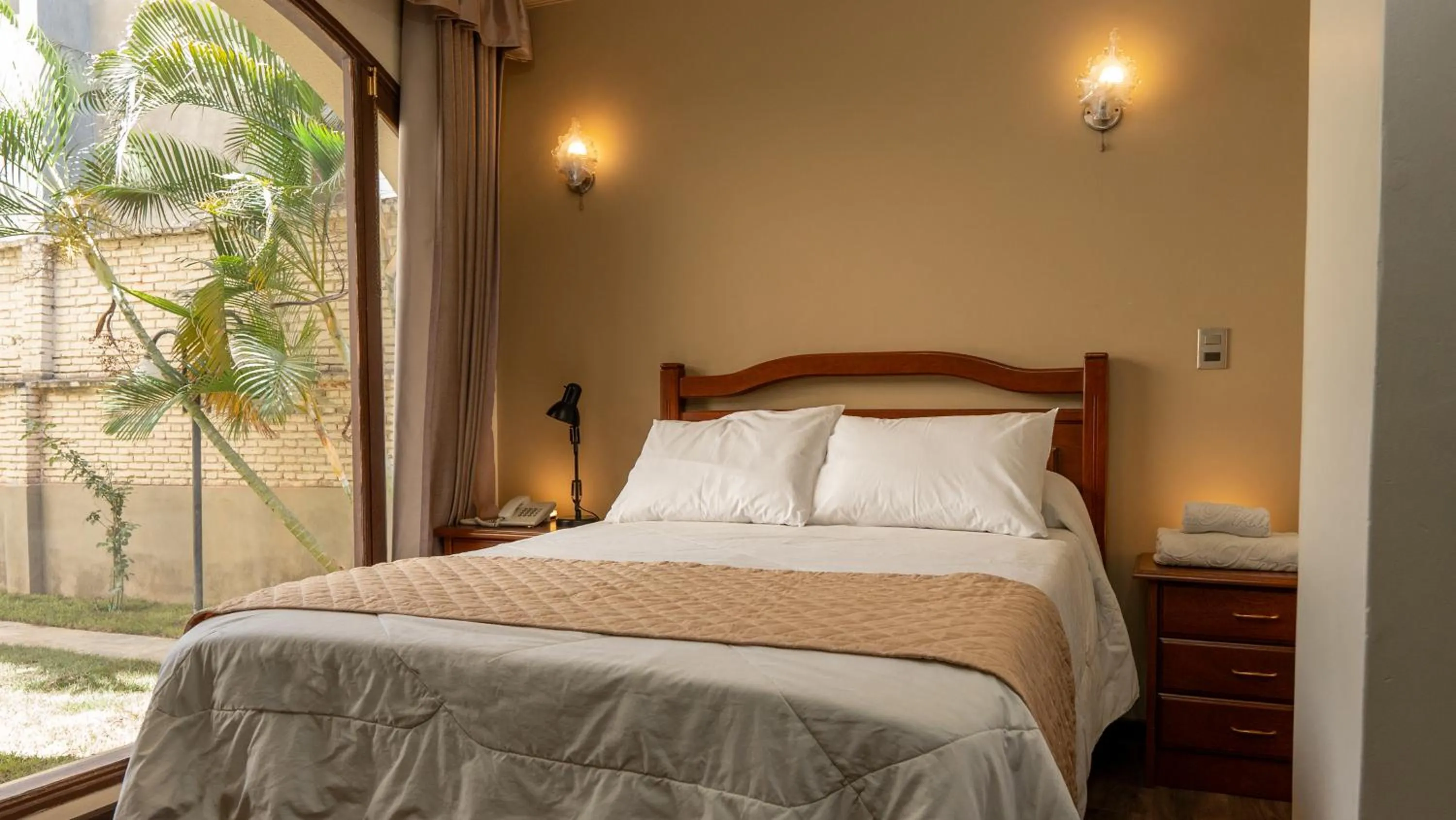 Bed in El Prado Hotel