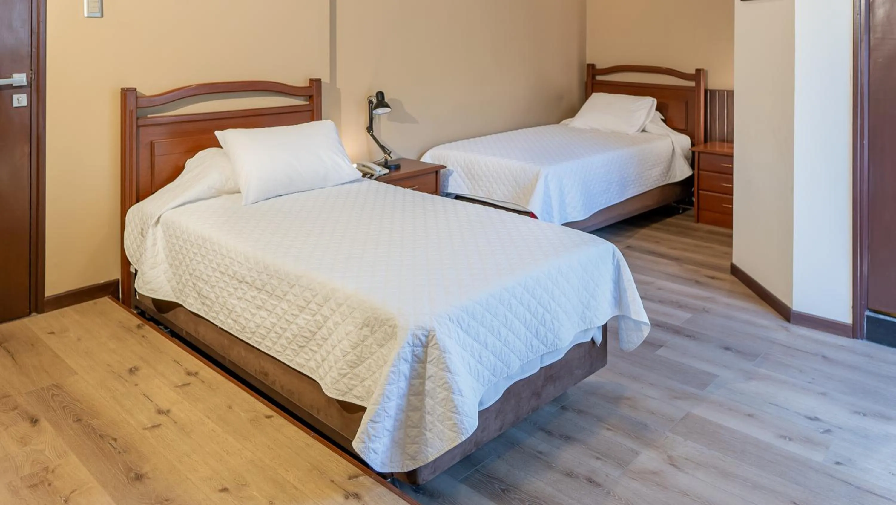 Bed in El Prado Hotel