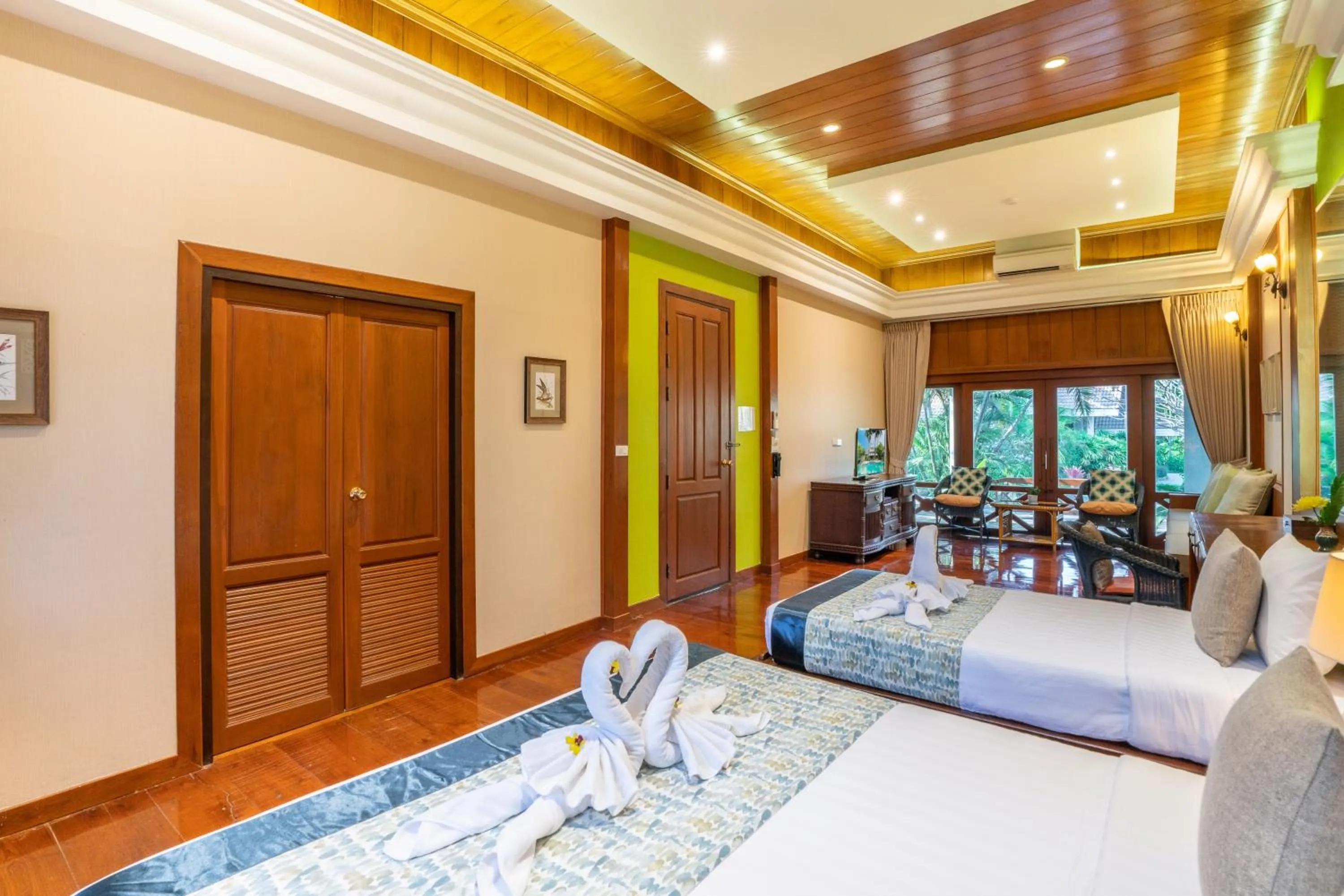 Bed in Le Charme Sukhothai Historical Park