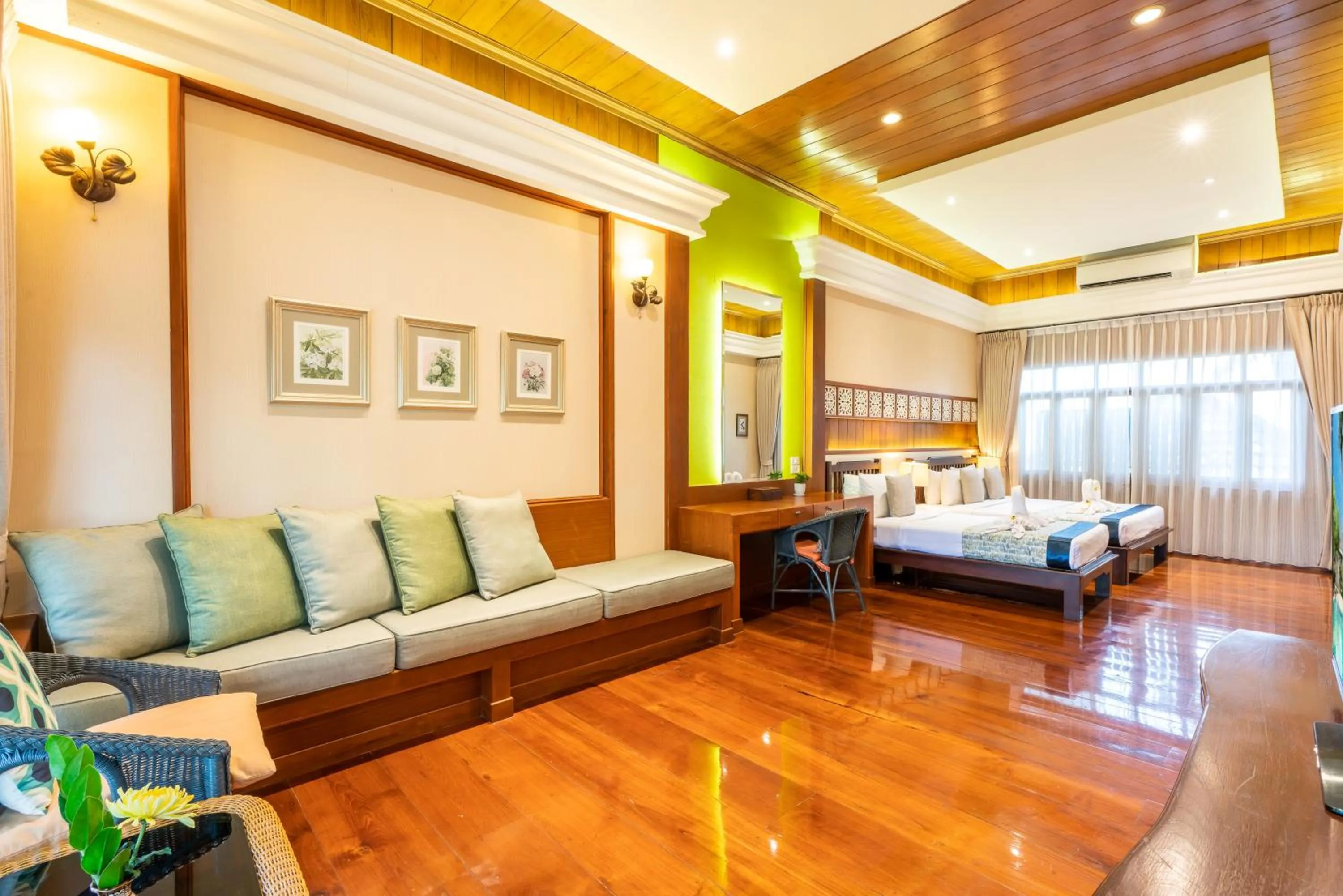 Bed in Le Charme Sukhothai Historical Park