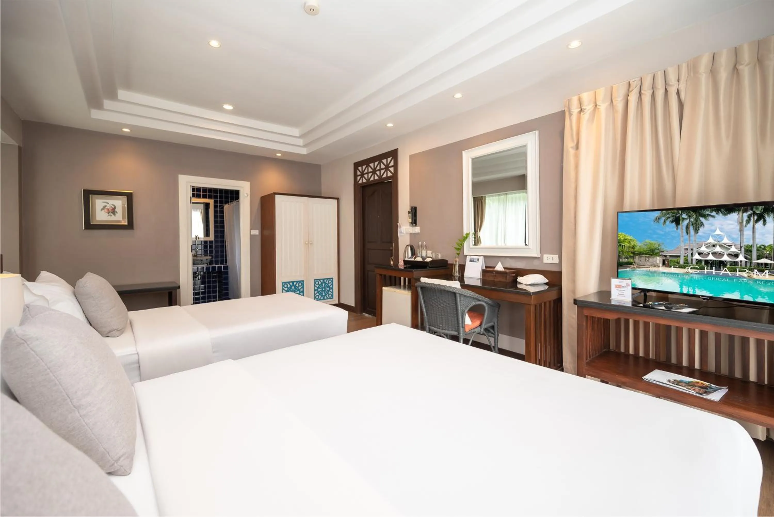 Bed in Le Charme Sukhothai Historical Park