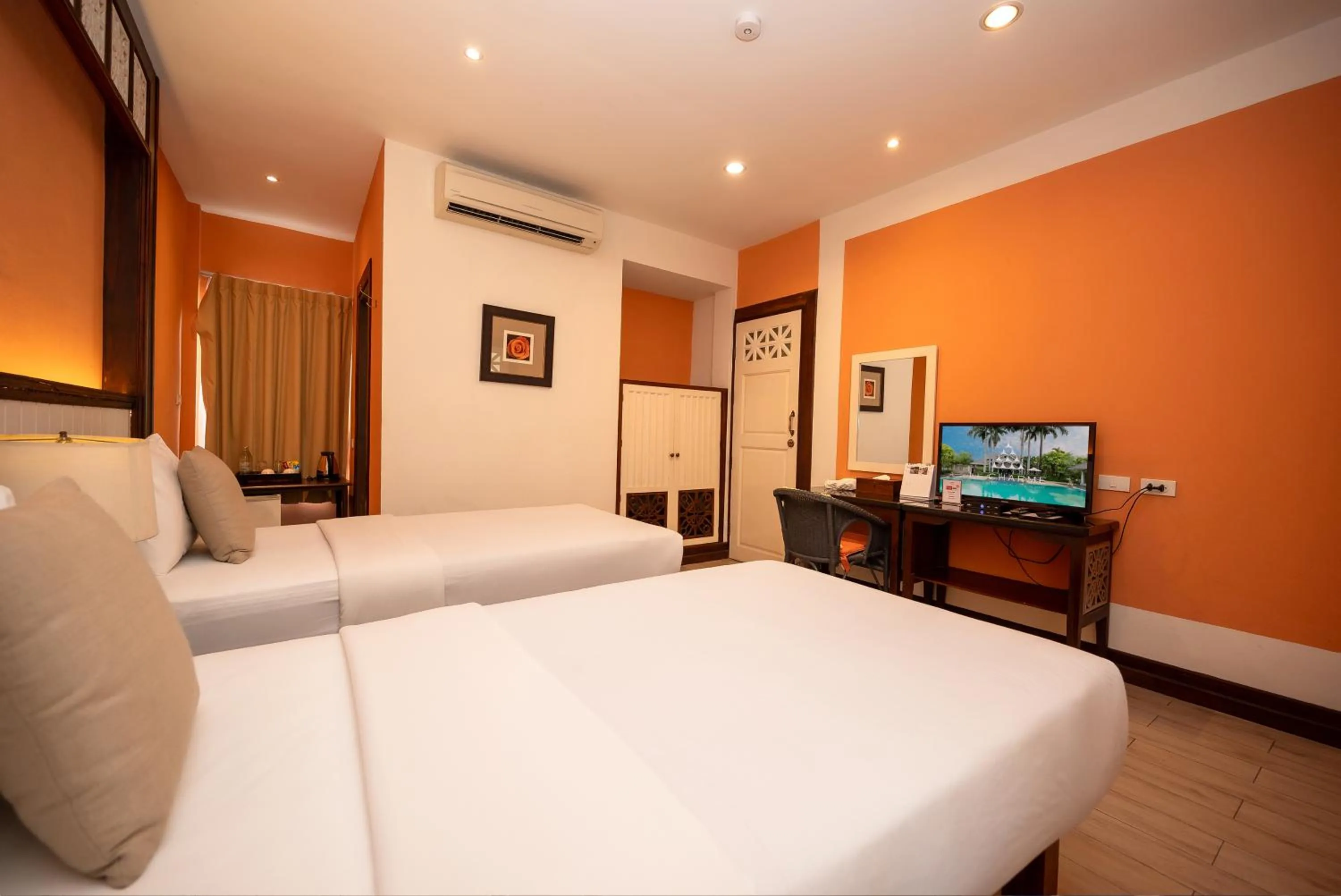 Bed in Le Charme Sukhothai Historical Park