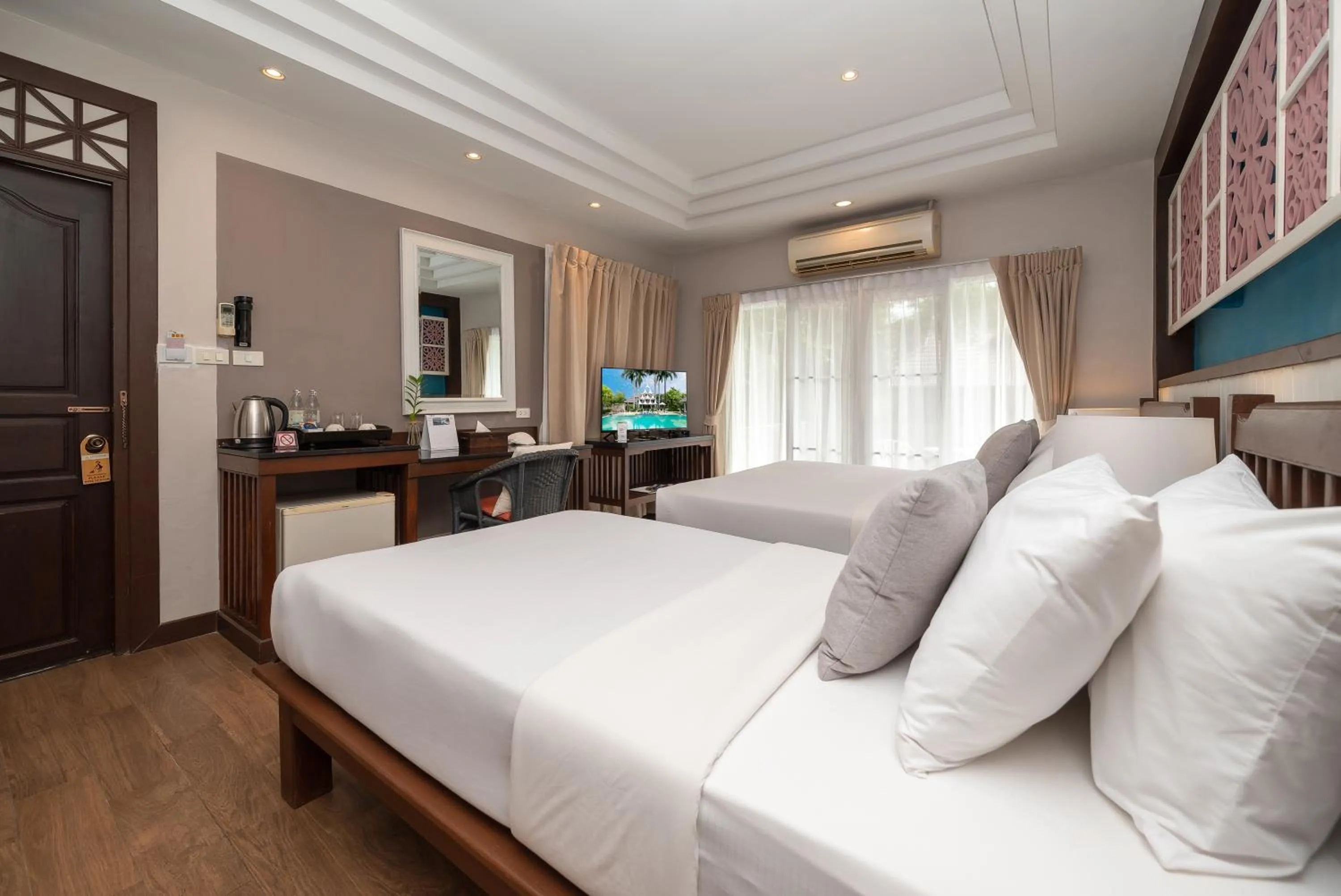 Bed in Le Charme Sukhothai Historical Park