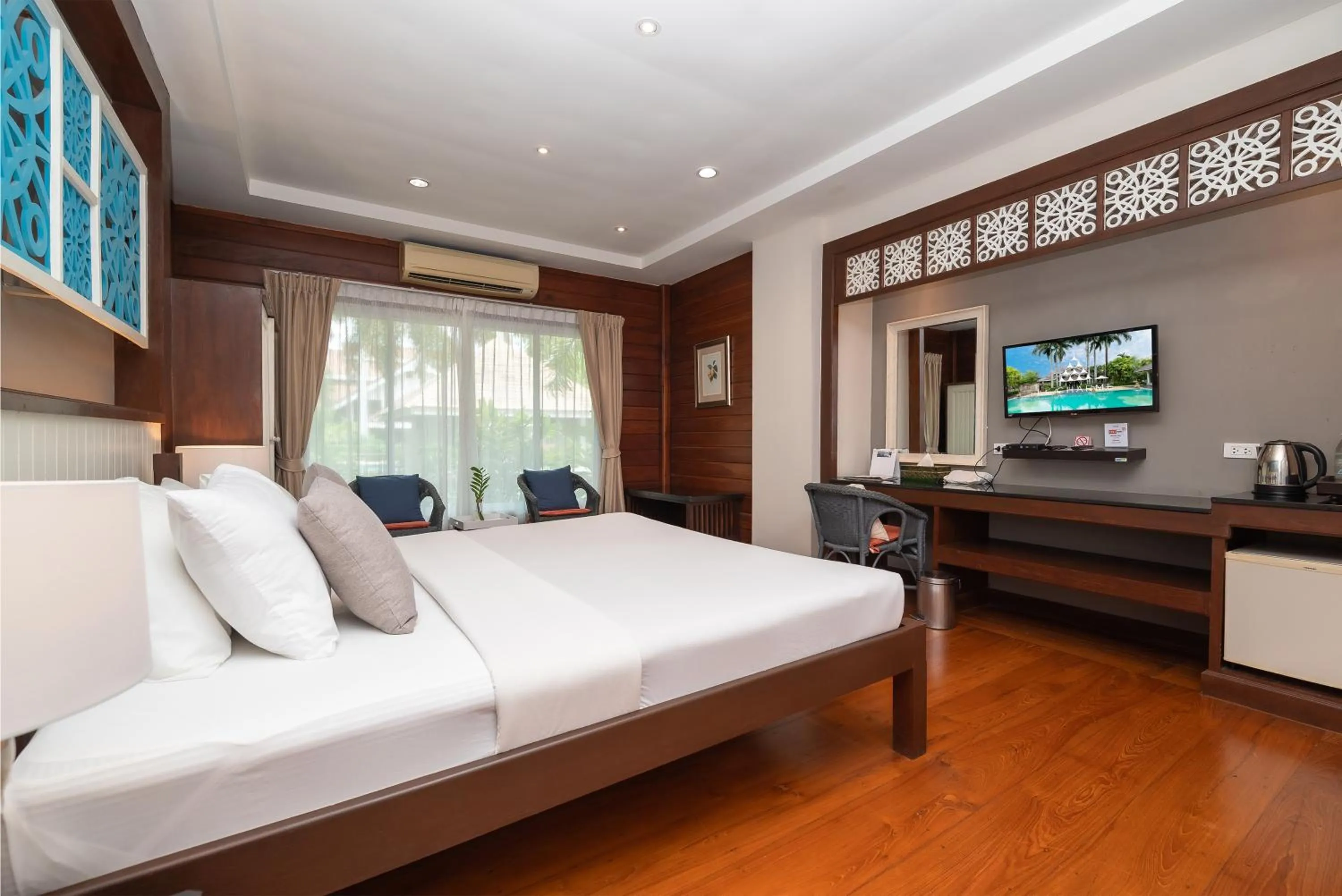 Bed in Le Charme Sukhothai Historical Park