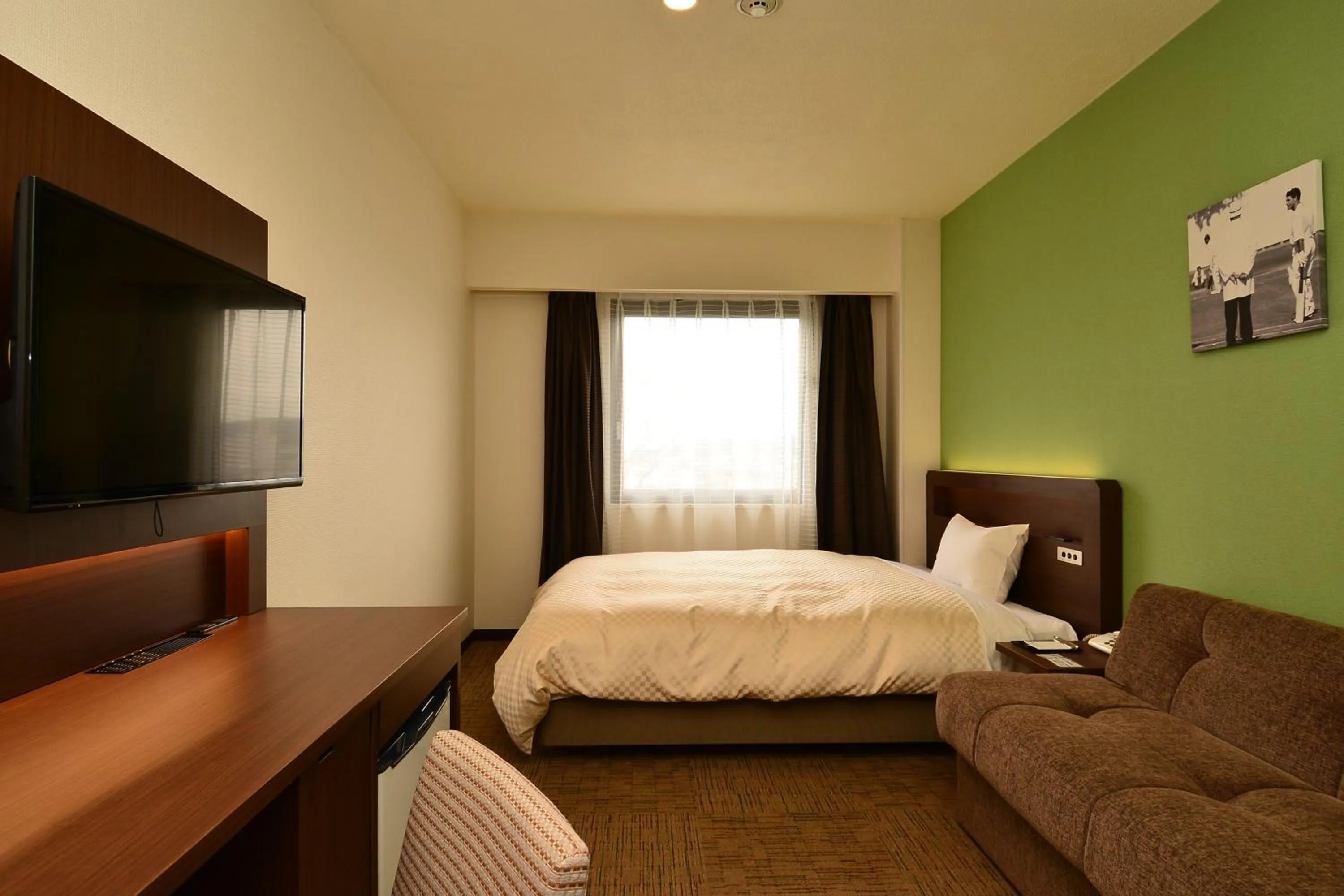 Bed in Hotel Sunroute Sano