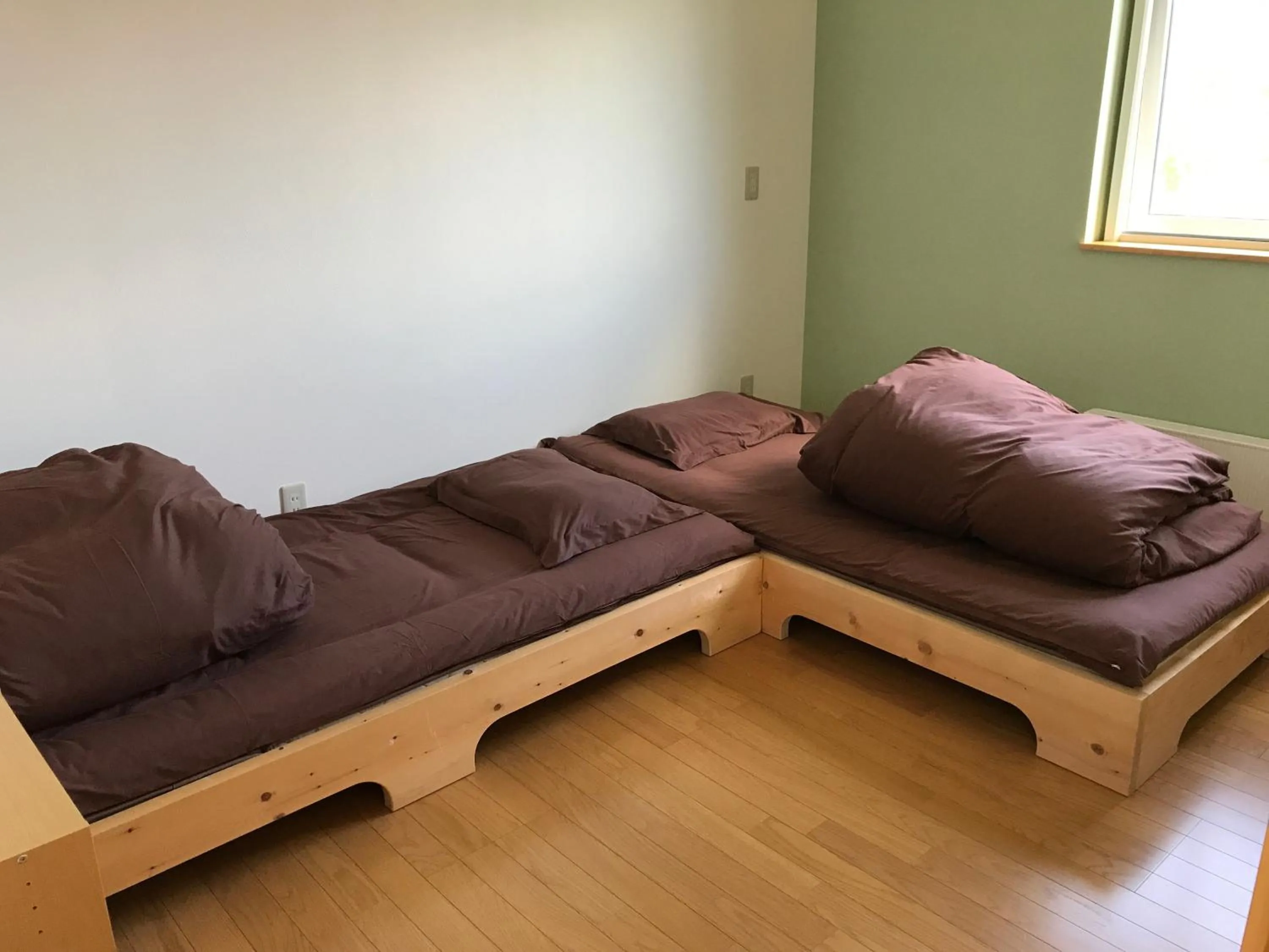 Bed in Niseko Guesthouse Nalu.