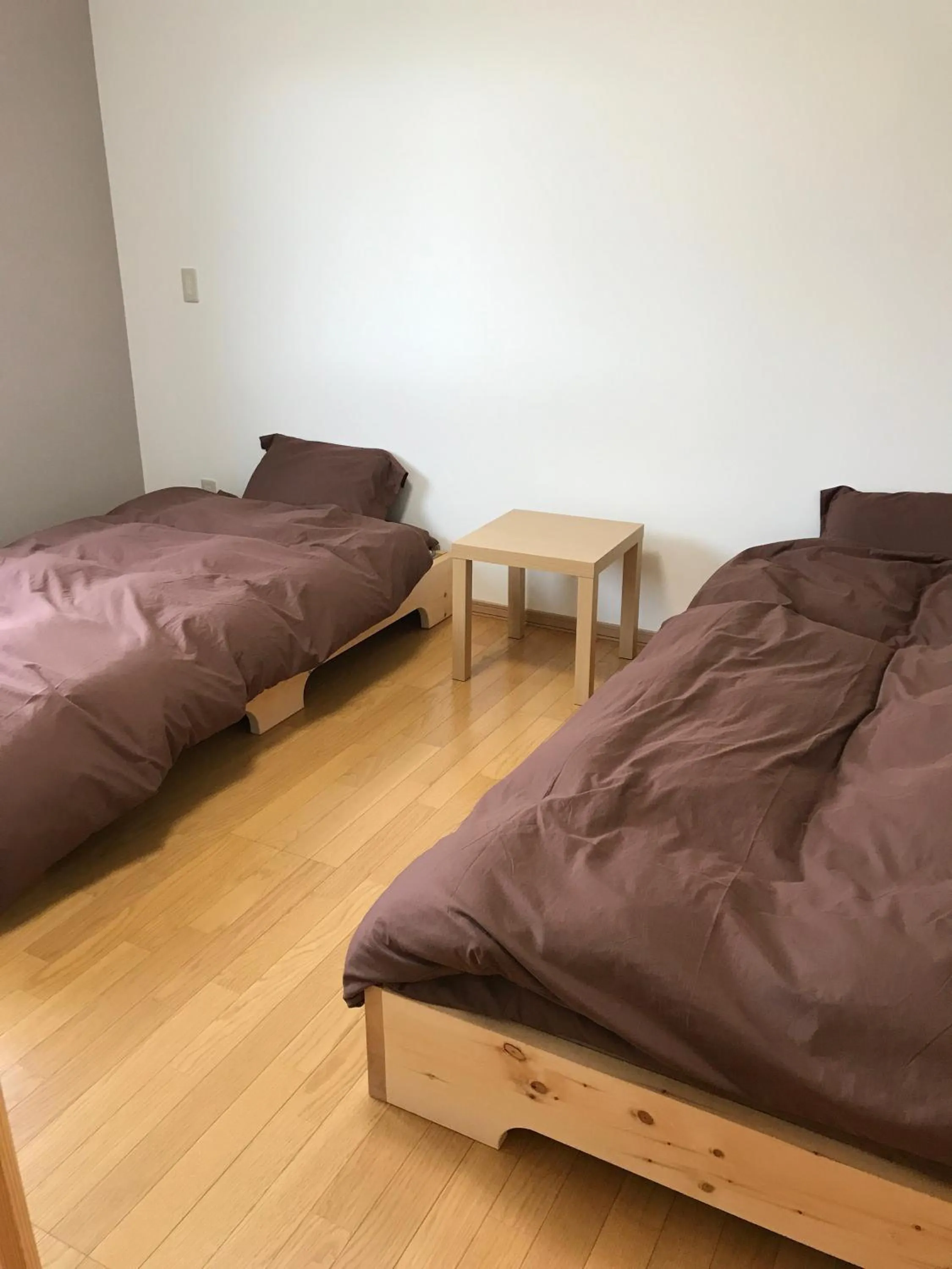 Bed in Niseko Guesthouse Nalu.