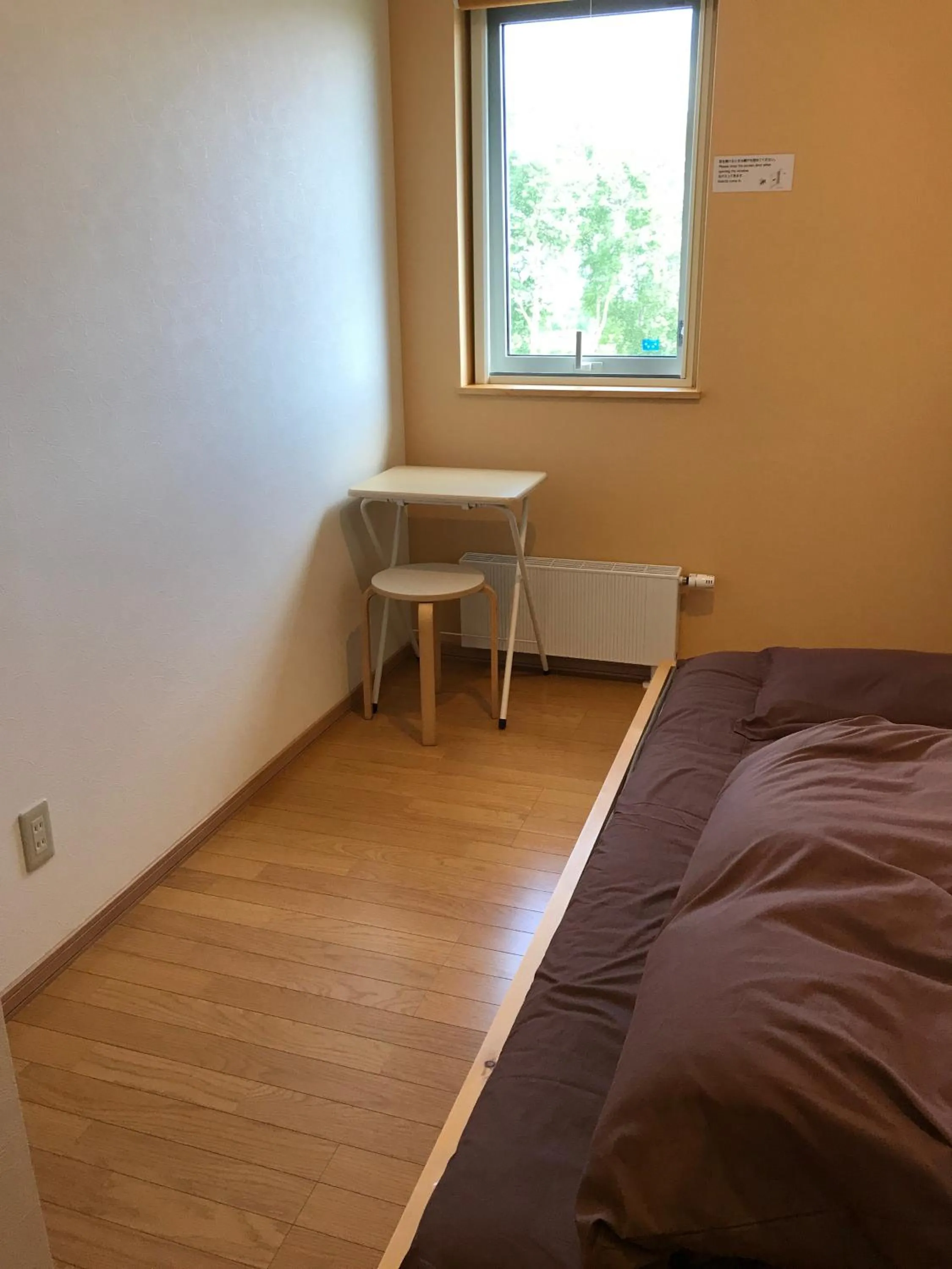 Bed in Niseko Guesthouse Nalu.