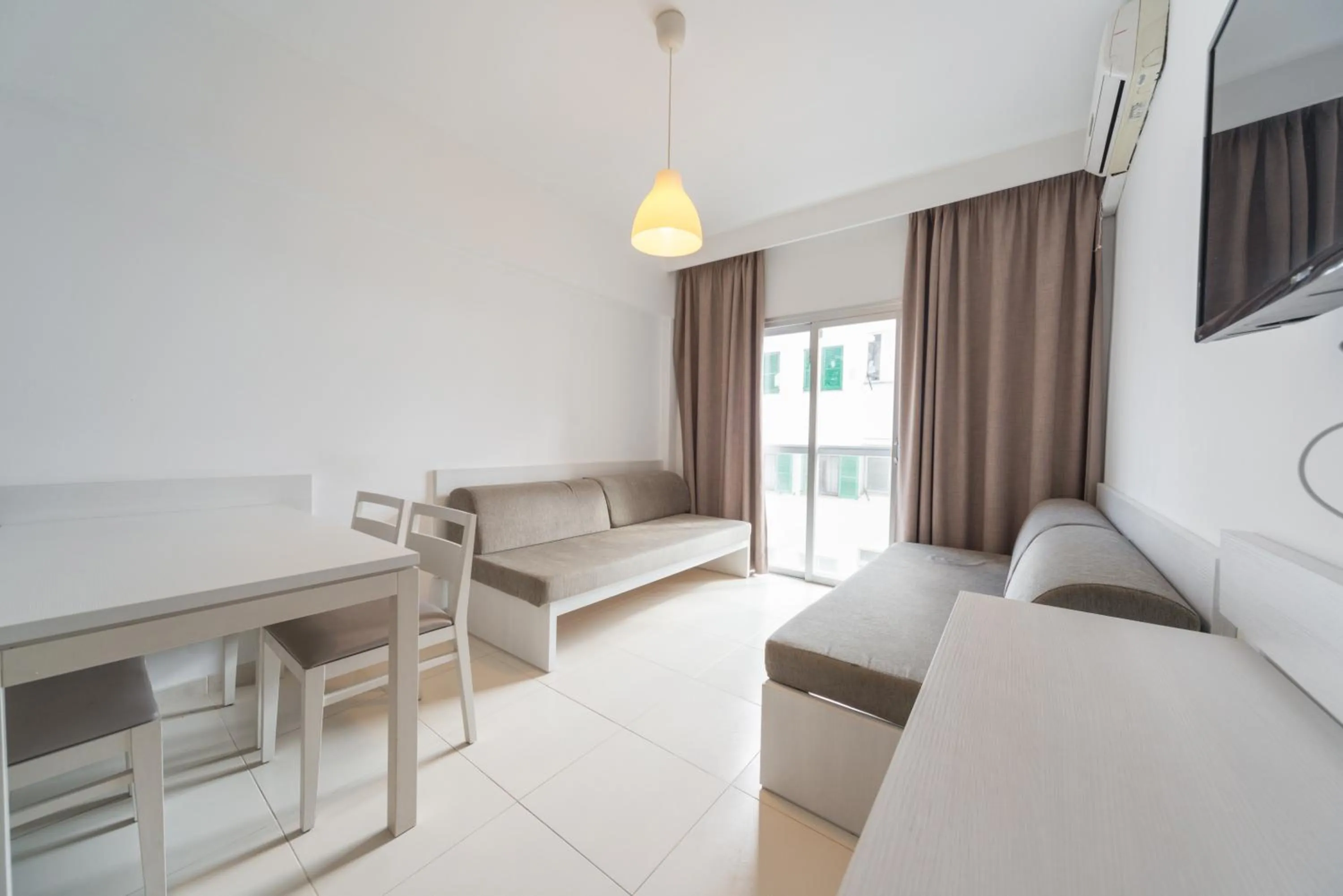 Living room, Bed in Apartamentos Embat