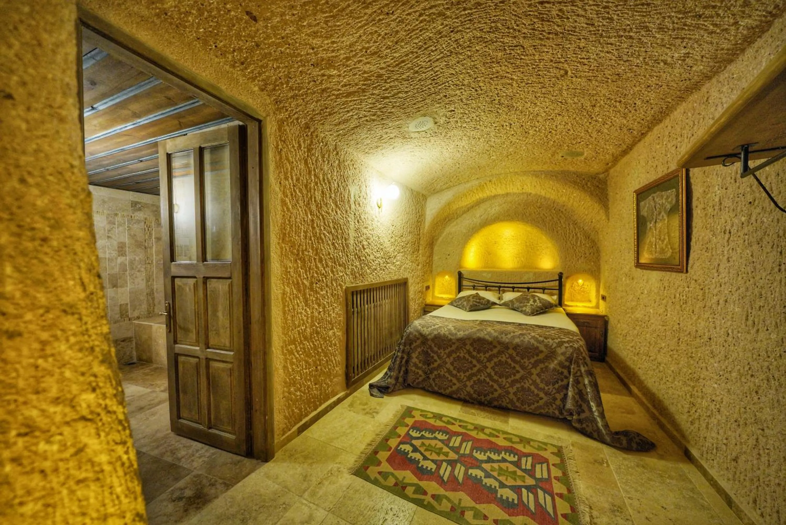 Bed in Takaev Cave House