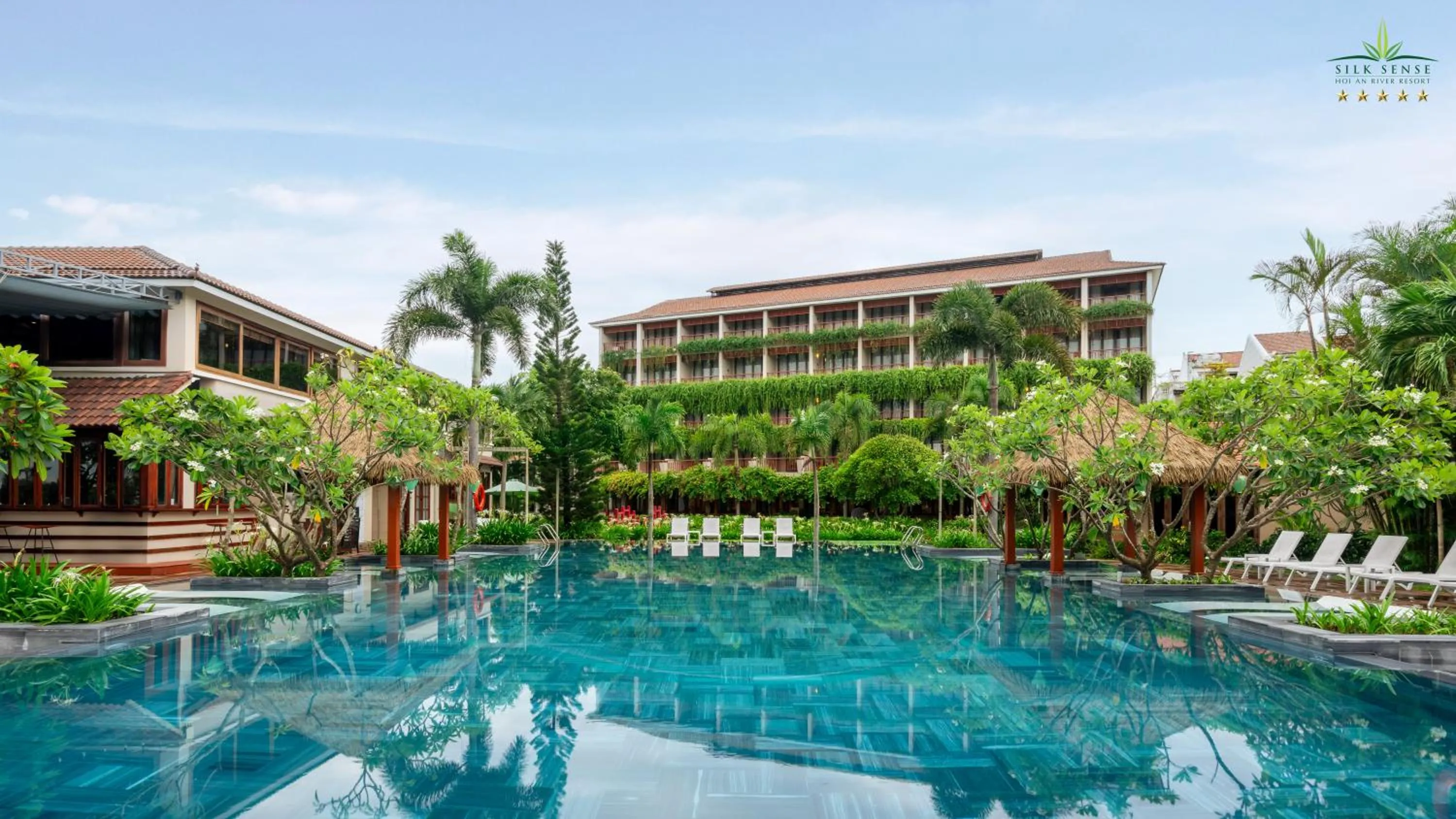Pool view in Silk Sense Hoi An River Resort - Green Luxury Escape