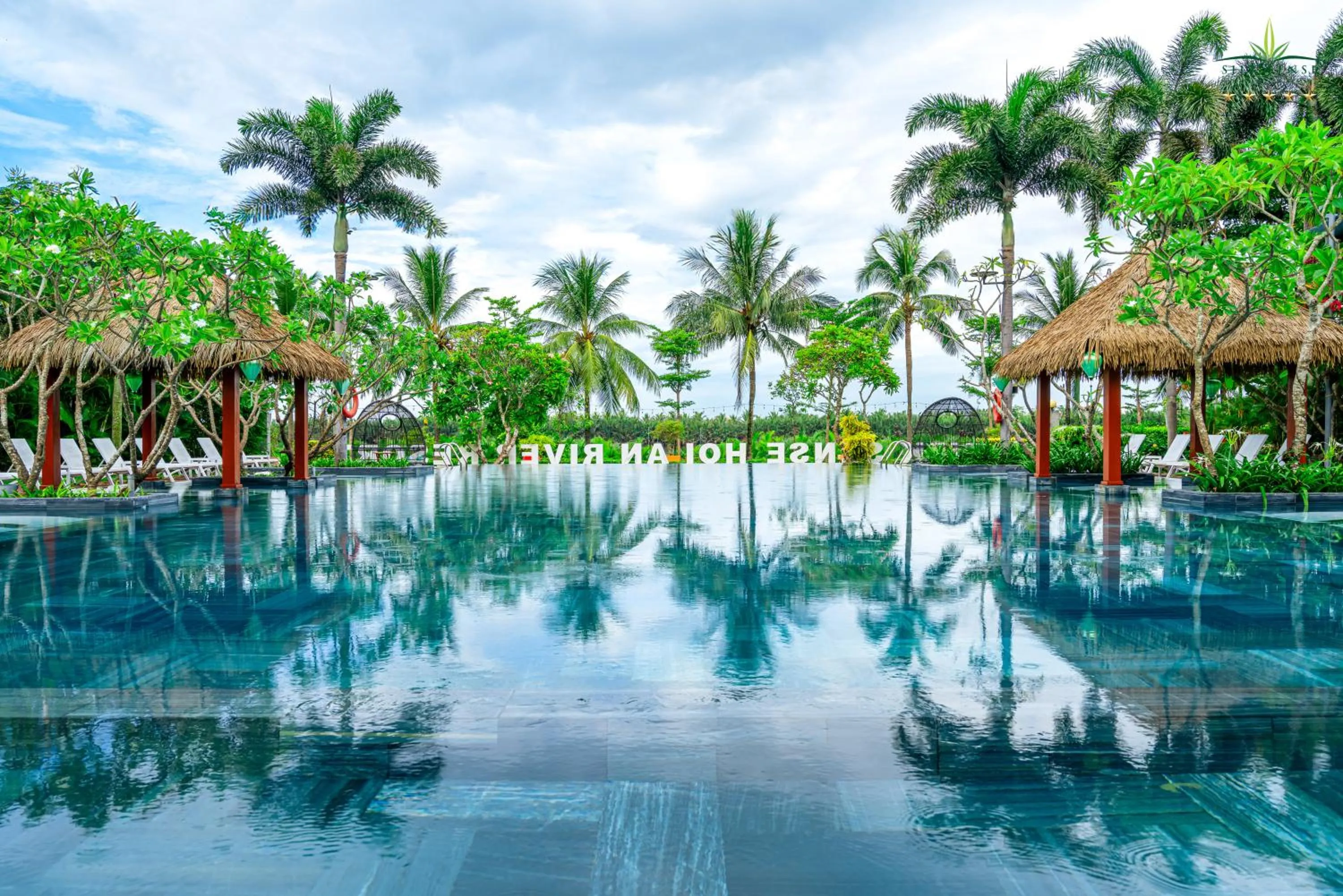 Pool view in Silk Sense Hoi An River Resort - Green Luxury Escape
