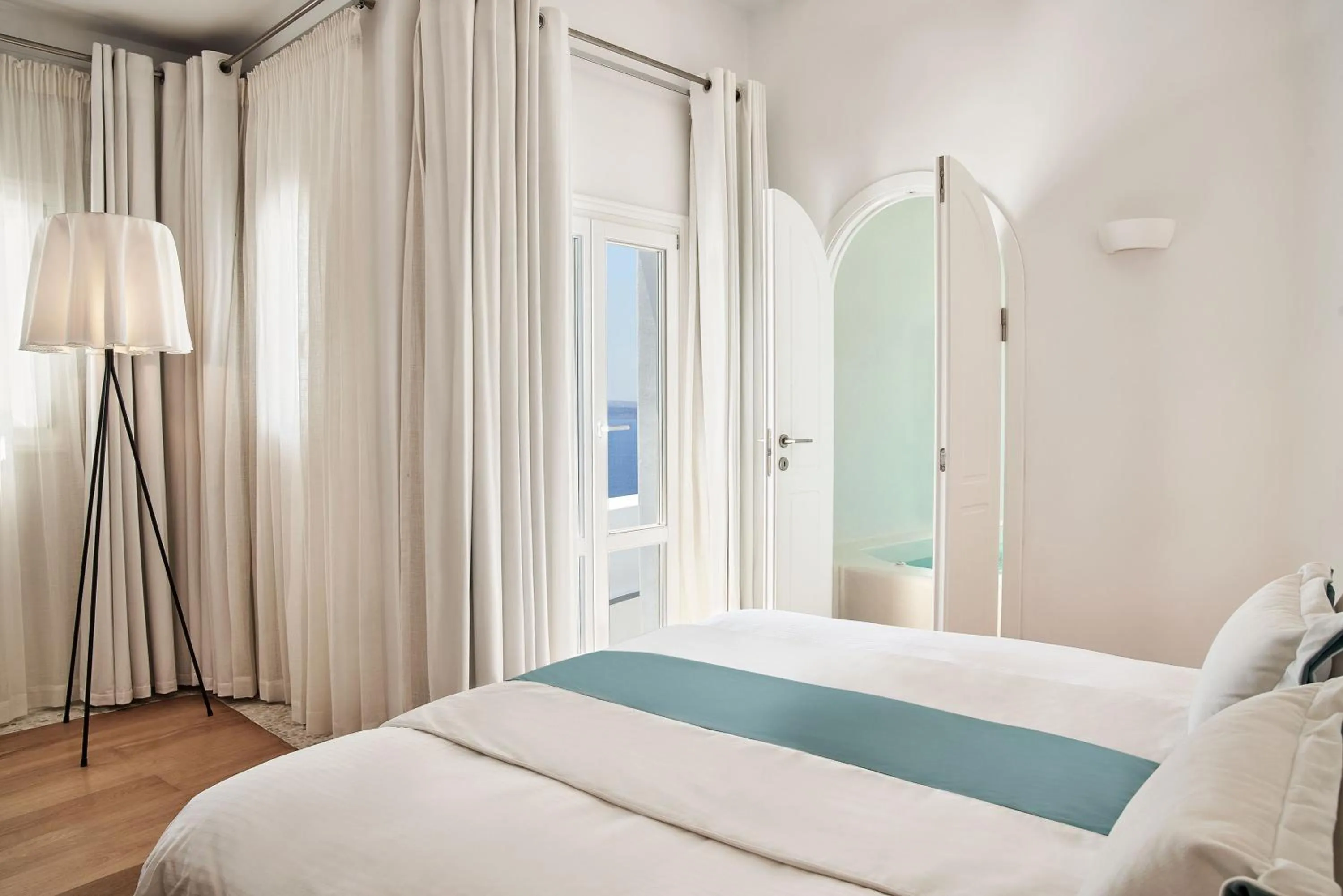 Photo of the whole room, Bed in Katikies Kirini Santorini - The Leading Hotels Of The World