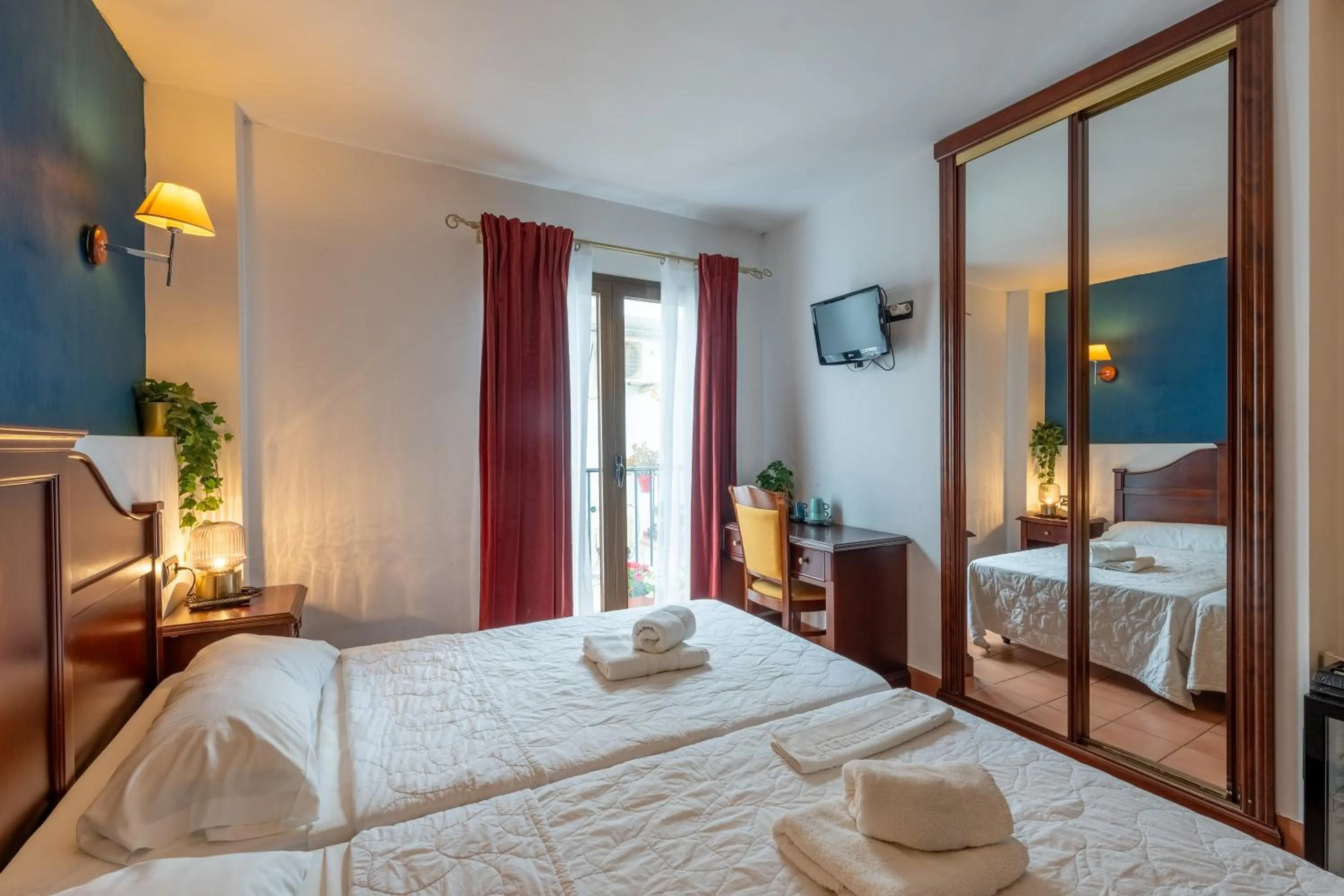 Bed in I AM La Posada Hotel and Apartment