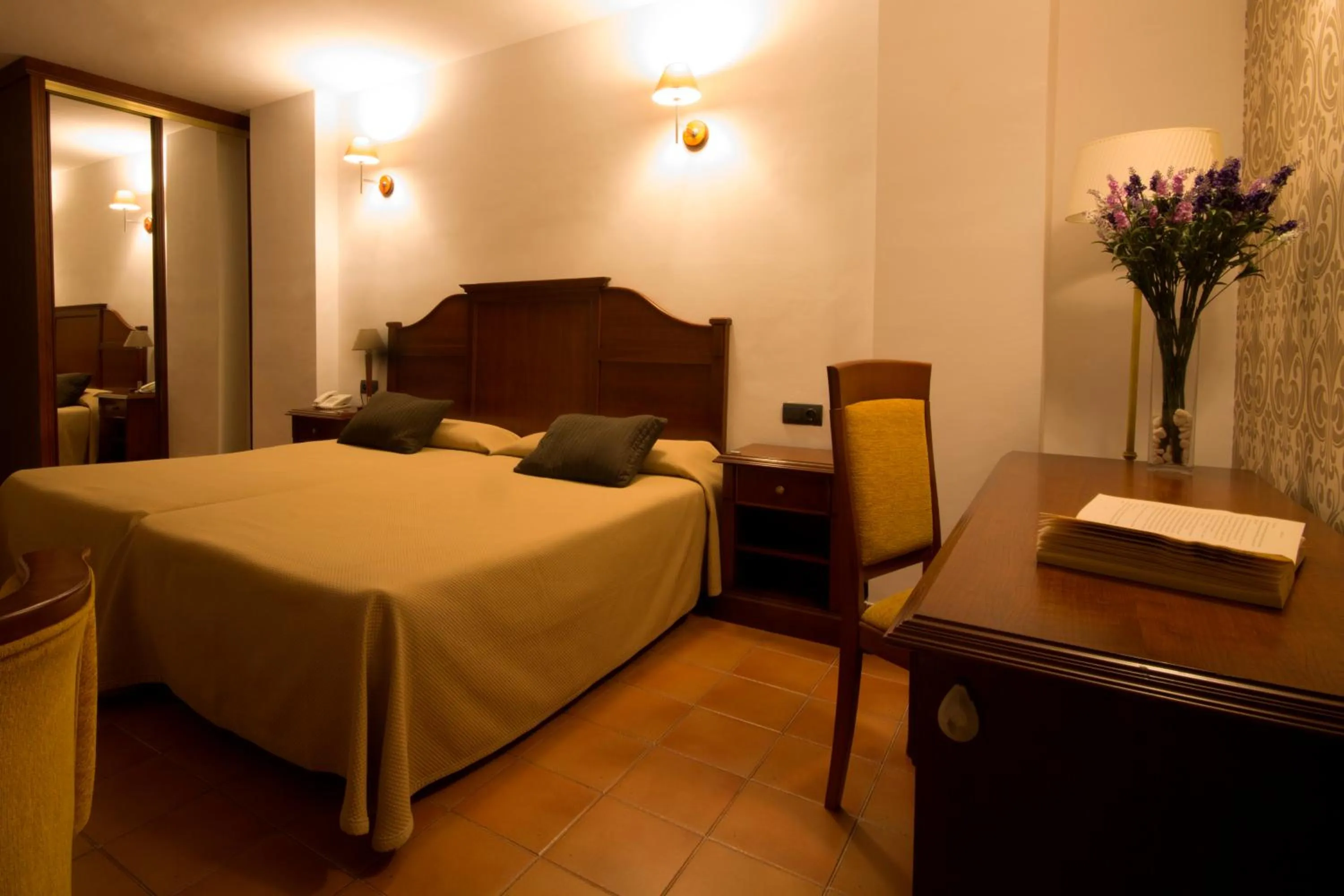 Bed in I AM La Posada Hotel and Apartment