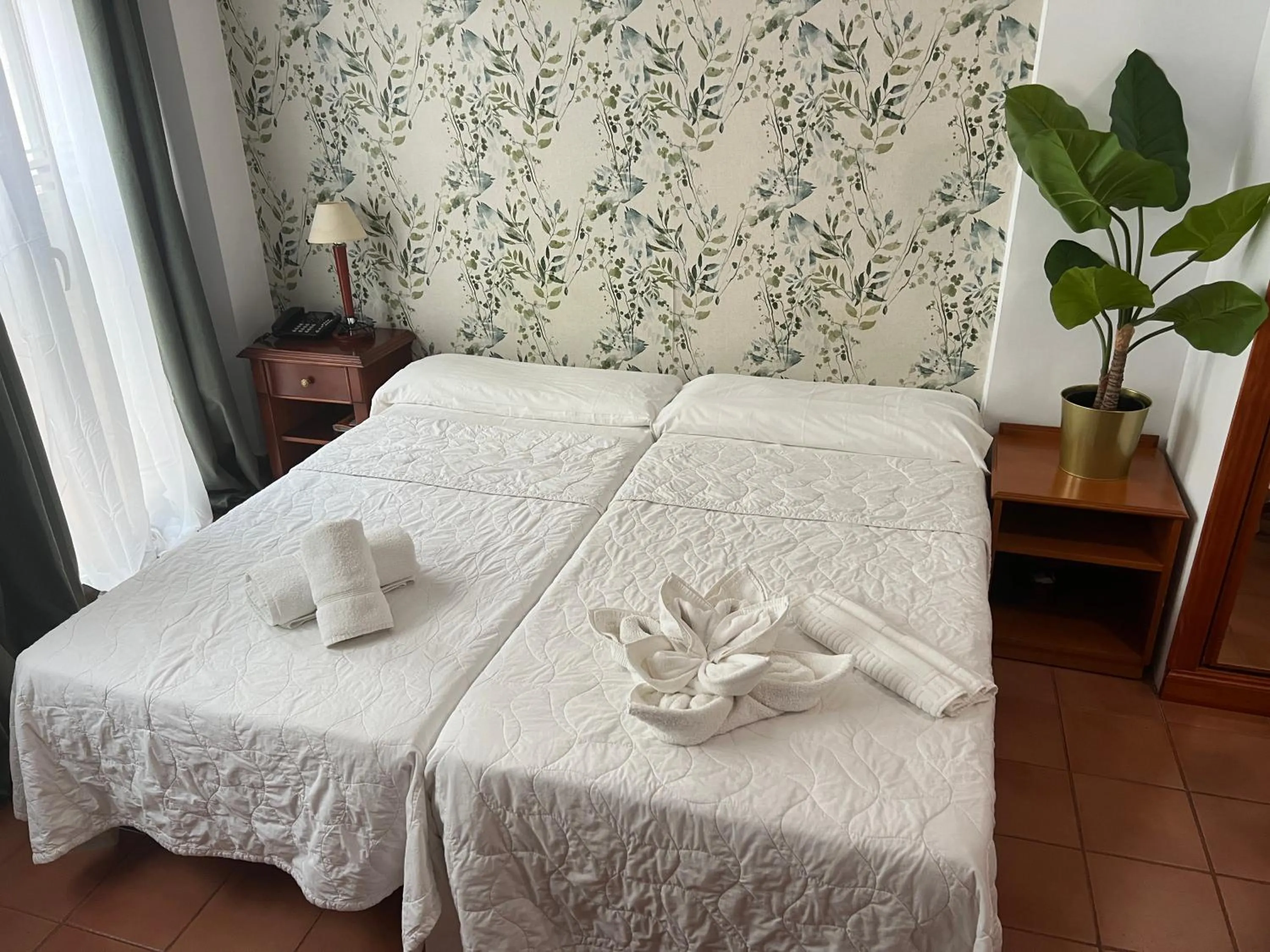 Bed in I AM La Posada Hotel and Apartment