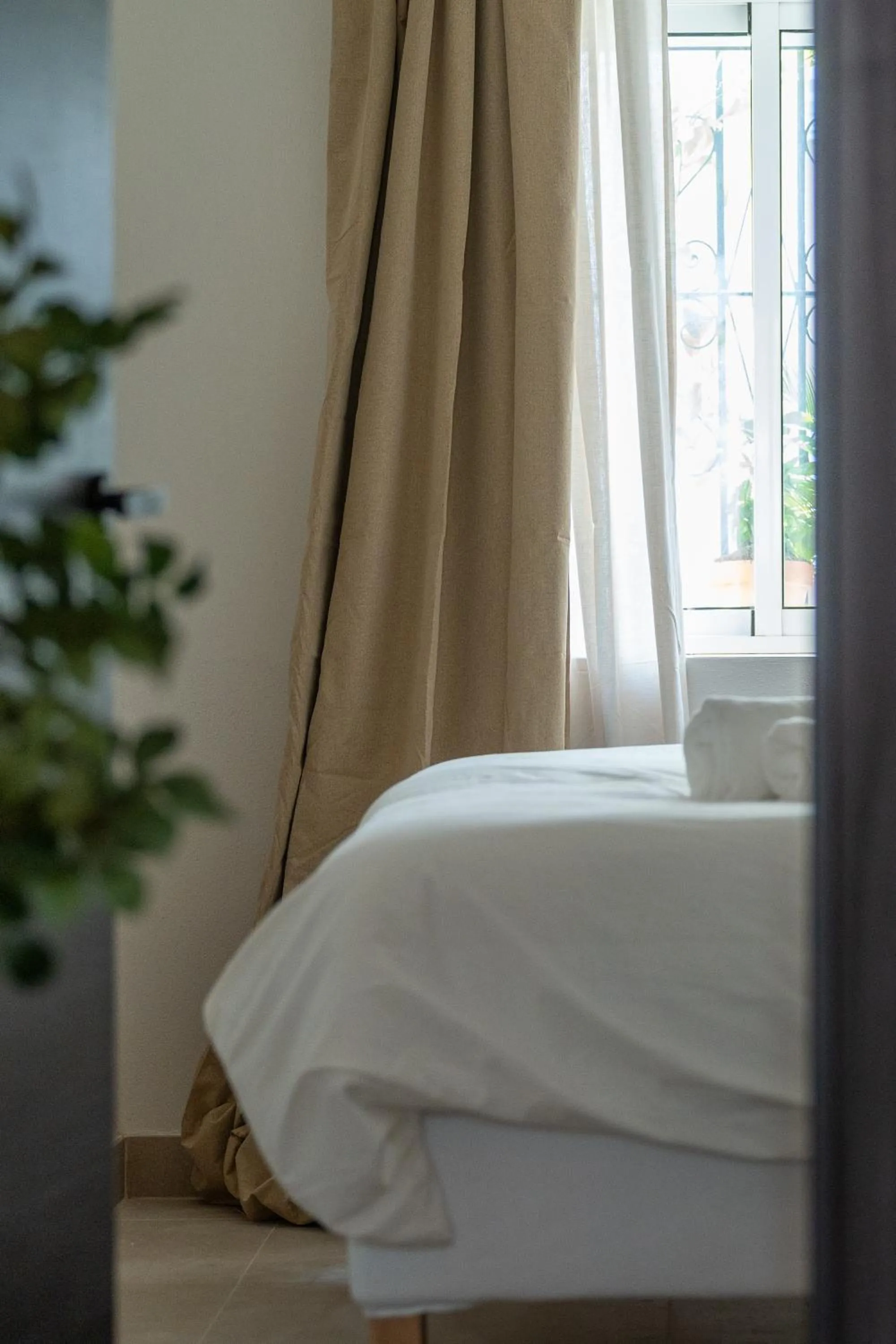 Bed in I AM La Posada Hotel and Apartment