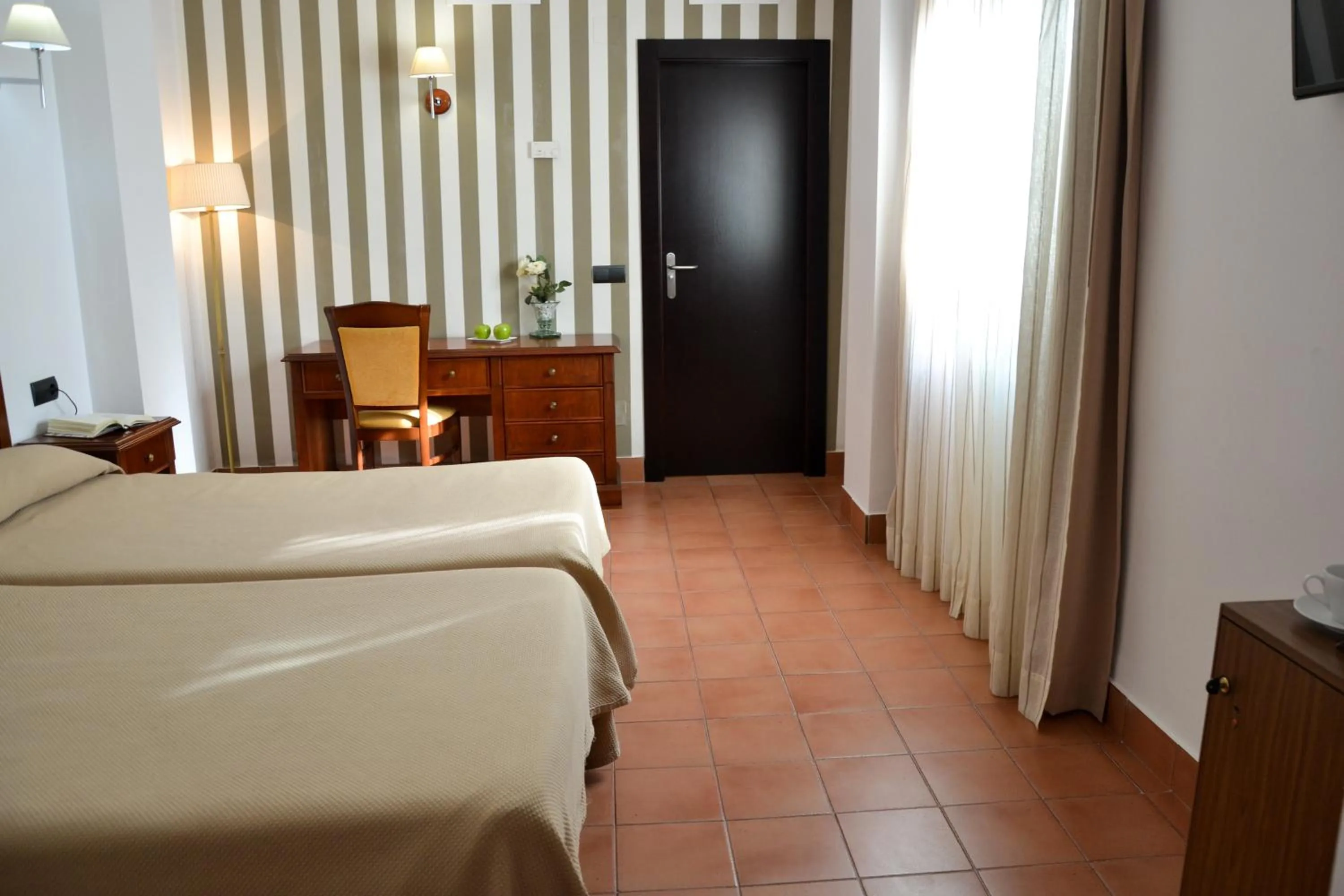 Photo of the whole room, Bed in I AM La Posada Hotel and Apartment