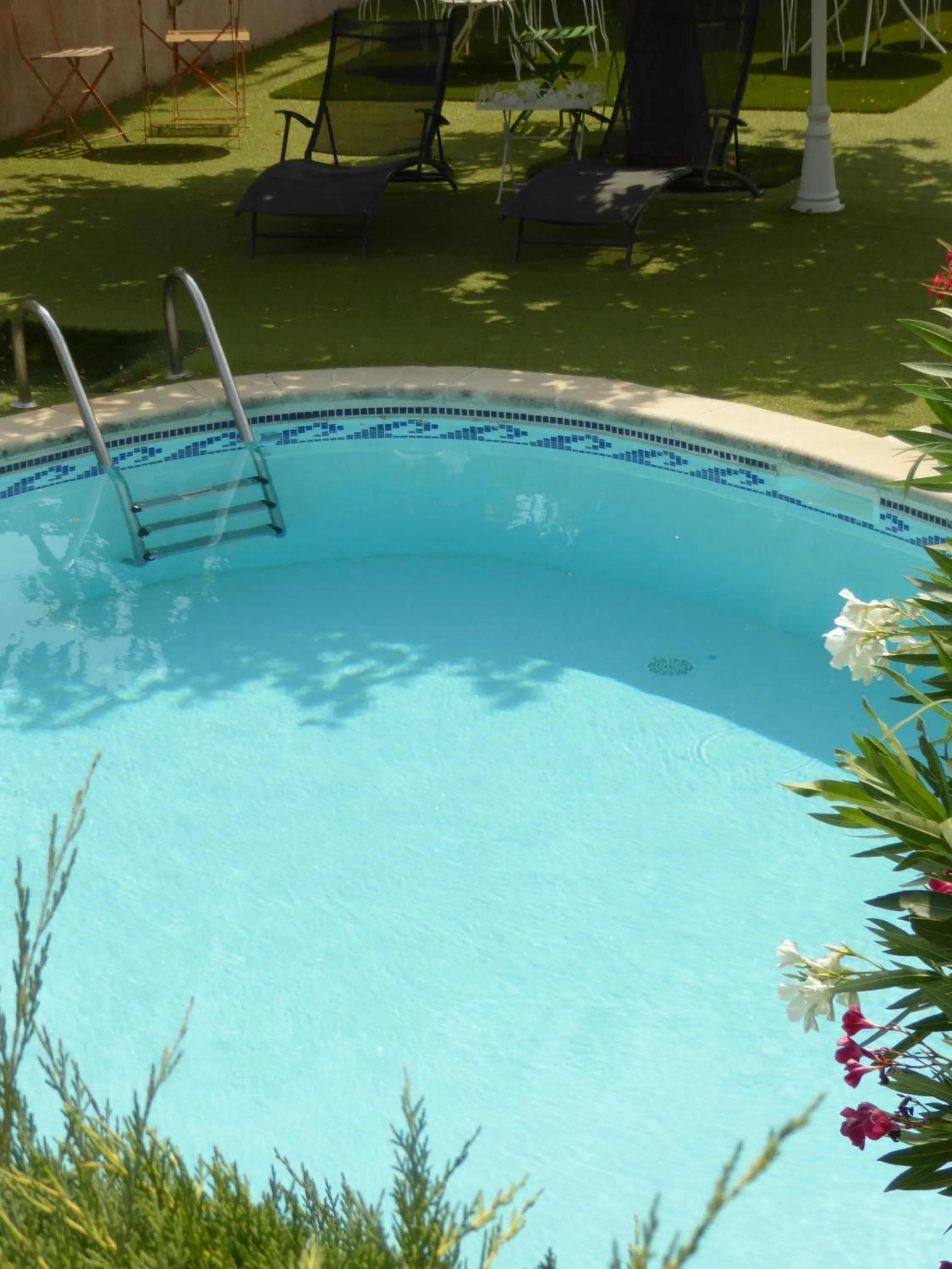 Pool view in Logis Hôtel La Fenière