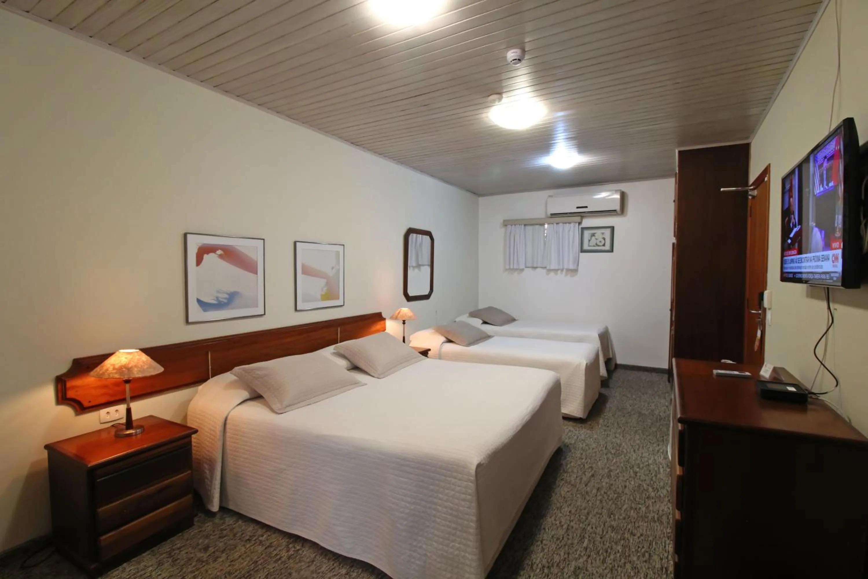 Bed in Pousada Villa Capivary Campos do Jordão