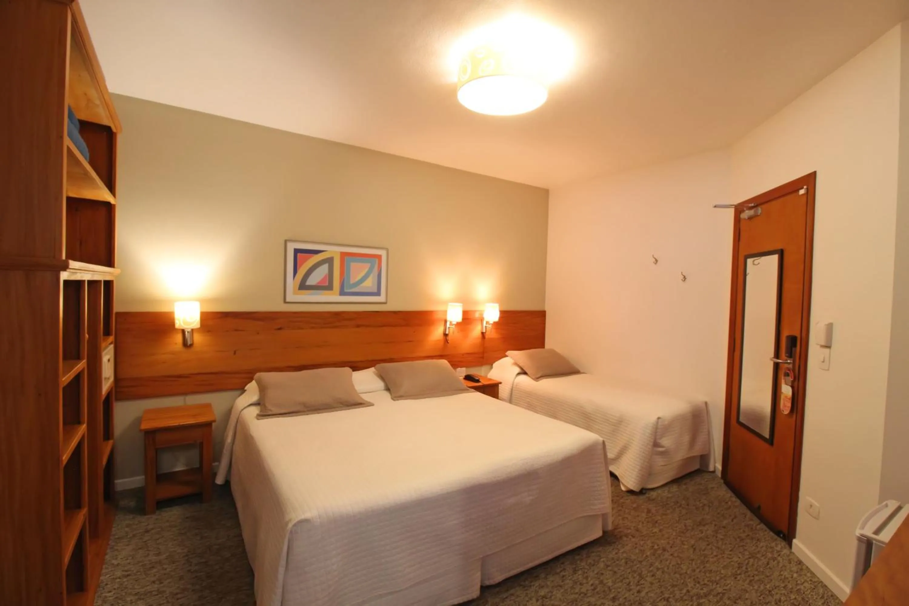 Bed in Pousada Villa Capivary Campos do Jordão