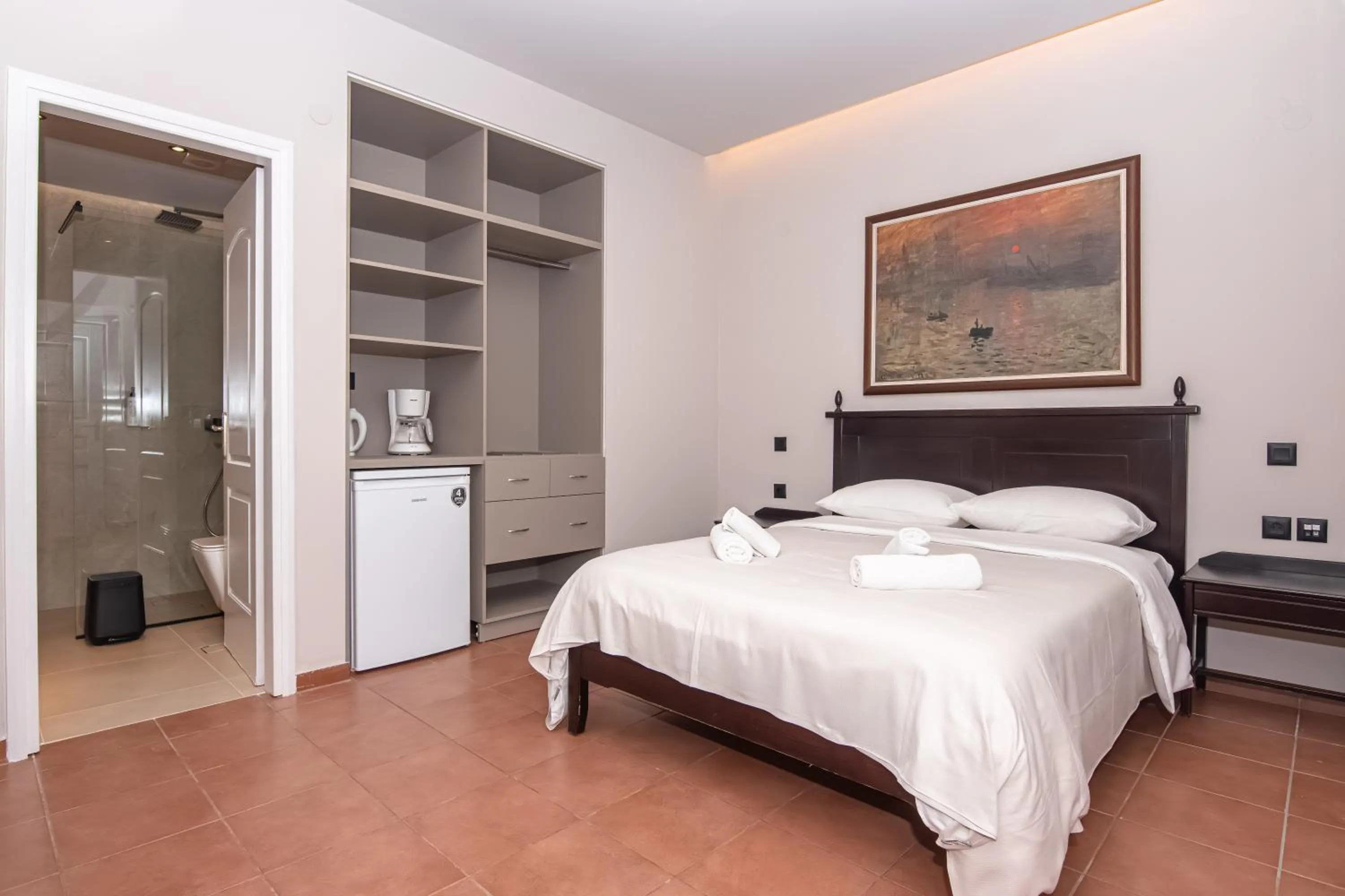 Bed in Talos Hotel Apartments