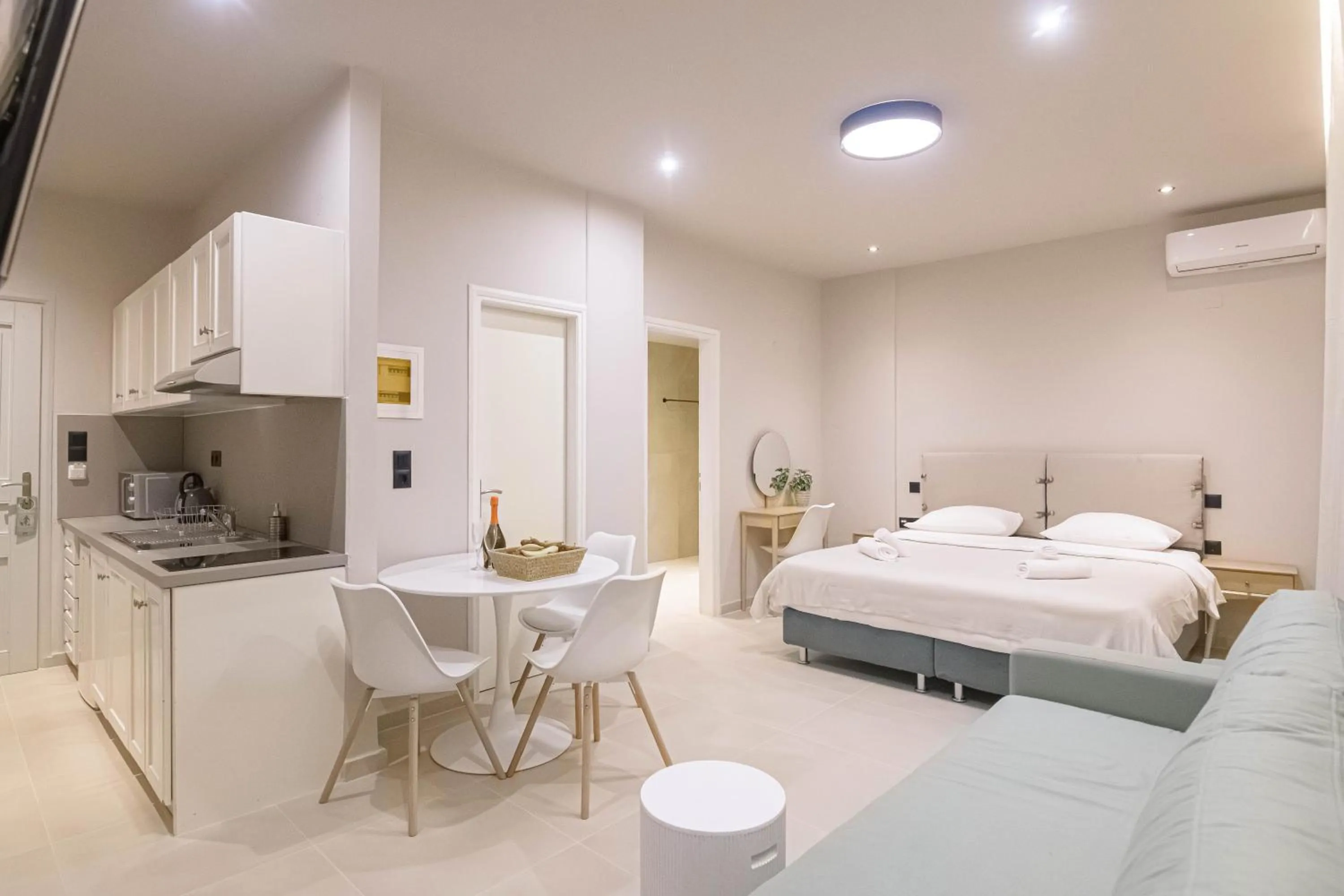 Bed in Talos Hotel Apartments