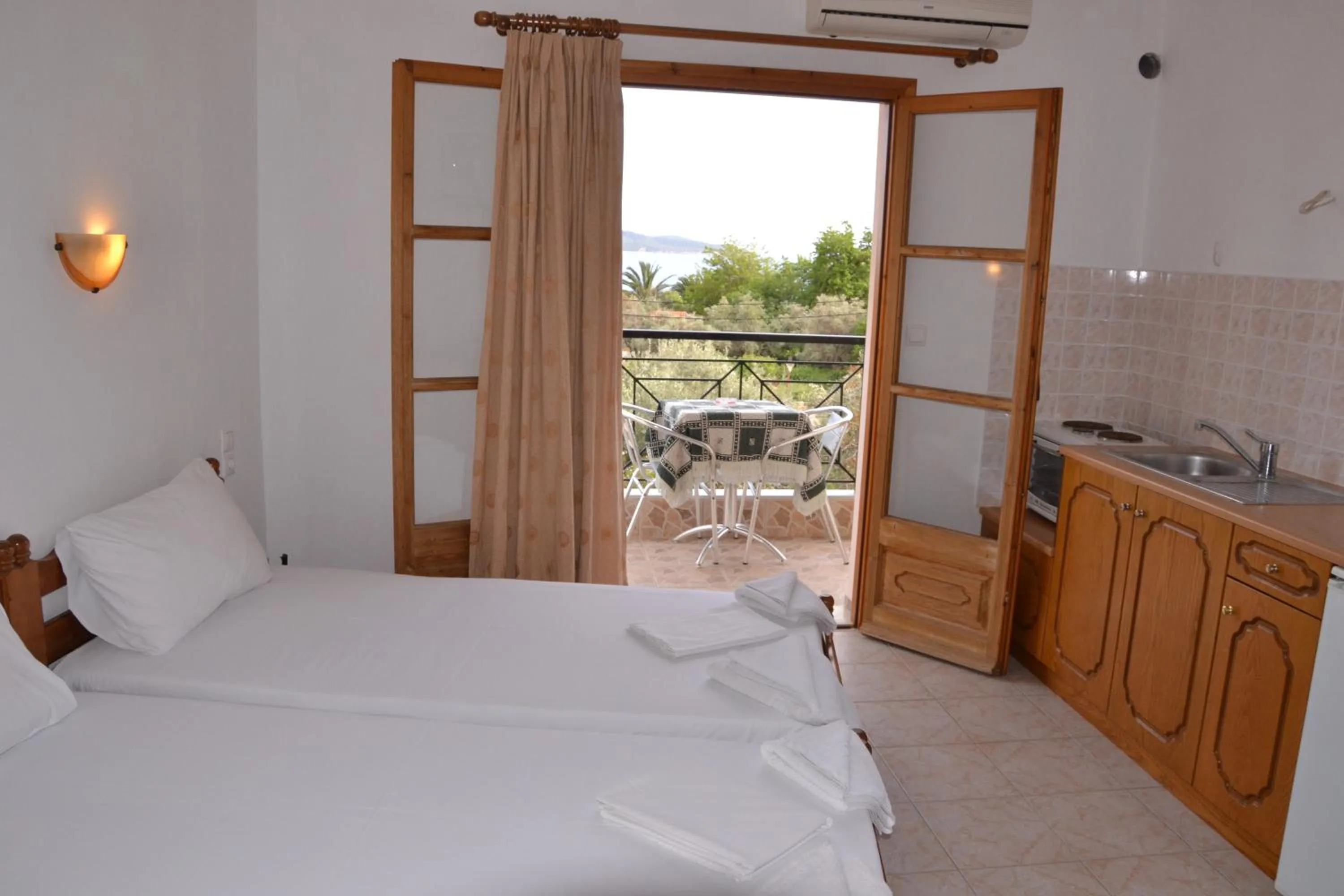 Photo of the whole room, Bed in Hellen Studios