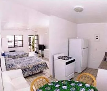 Kitchen or kitchenette, Bed in Napoli Belmar Resort