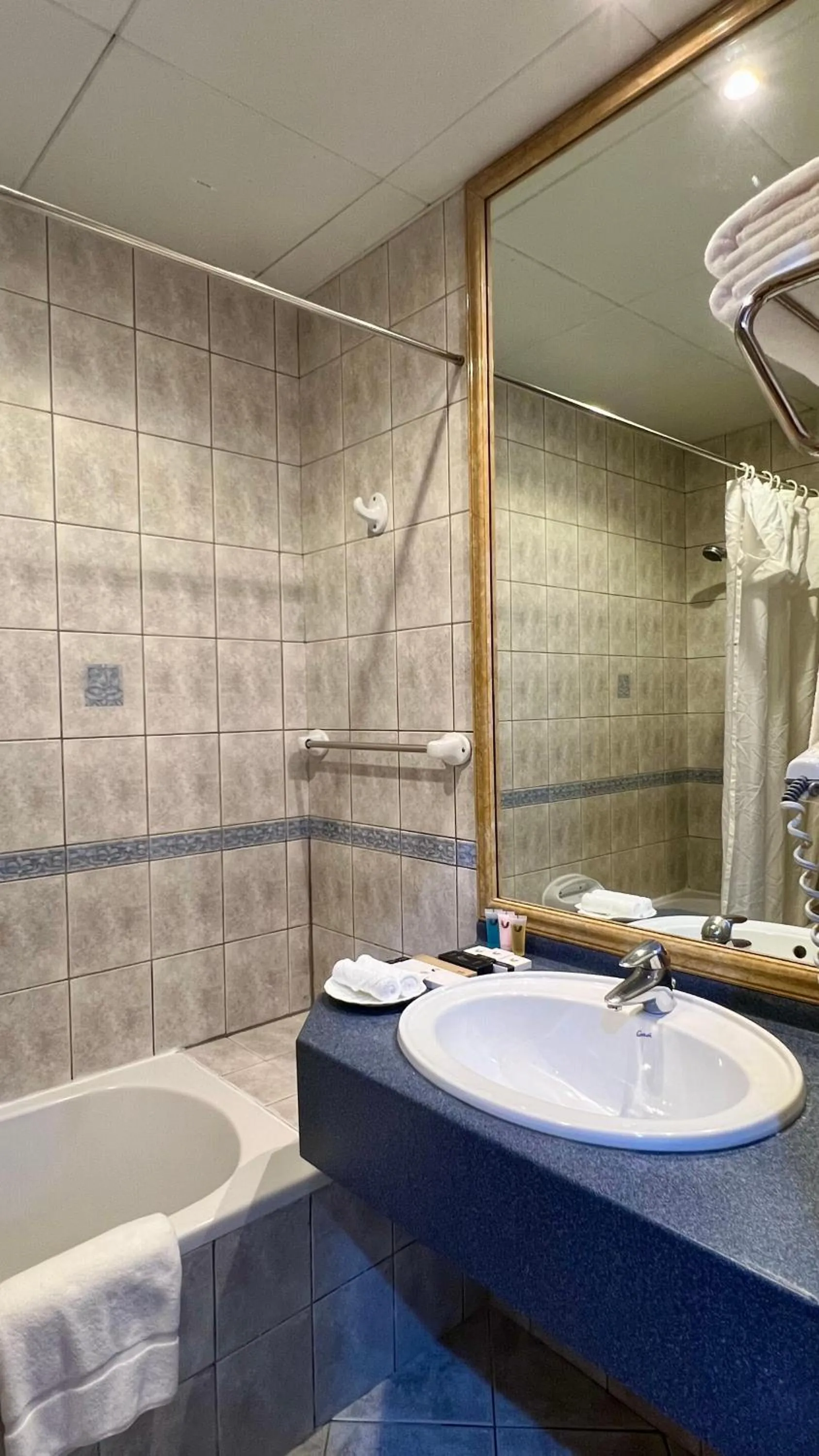 Bathroom in Uptown Hotel Apartments Abu Dhabi by Gewan