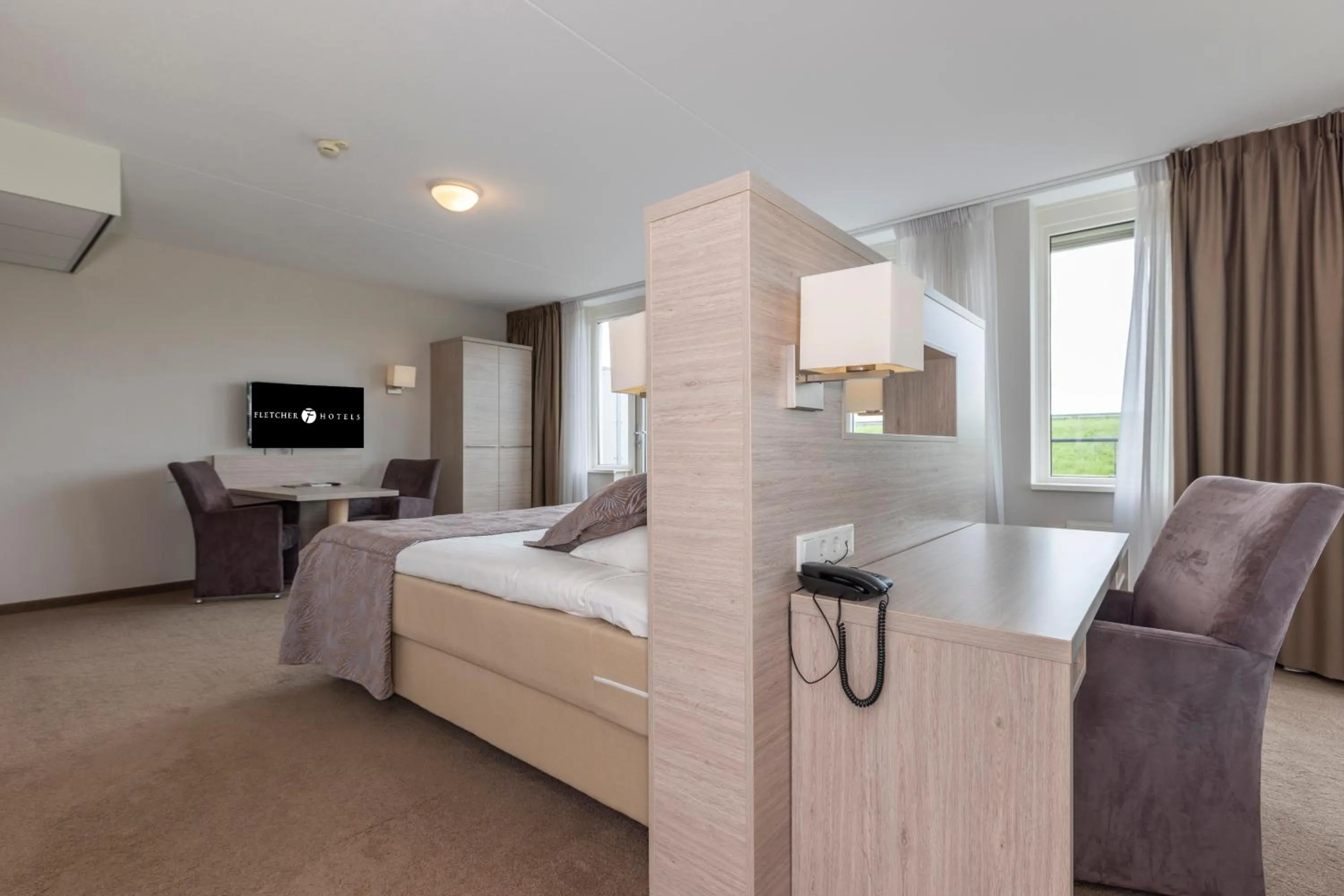 Photo of the whole room, Bed in Fletcher Wellness-Hotel Kamperduinen