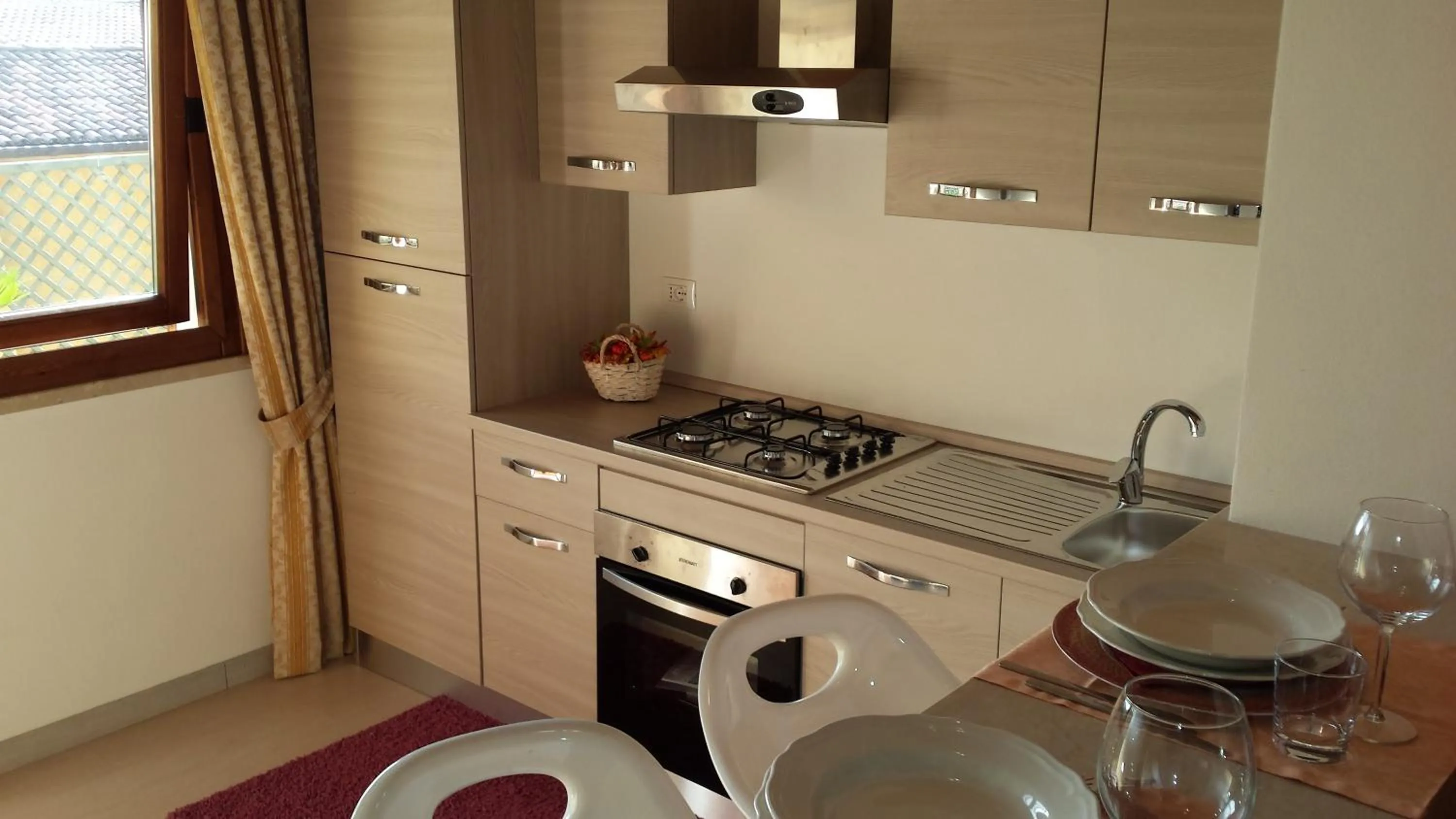 Kitchen or kitchenette in Garda Sol SPA Hotel & Appartamenti