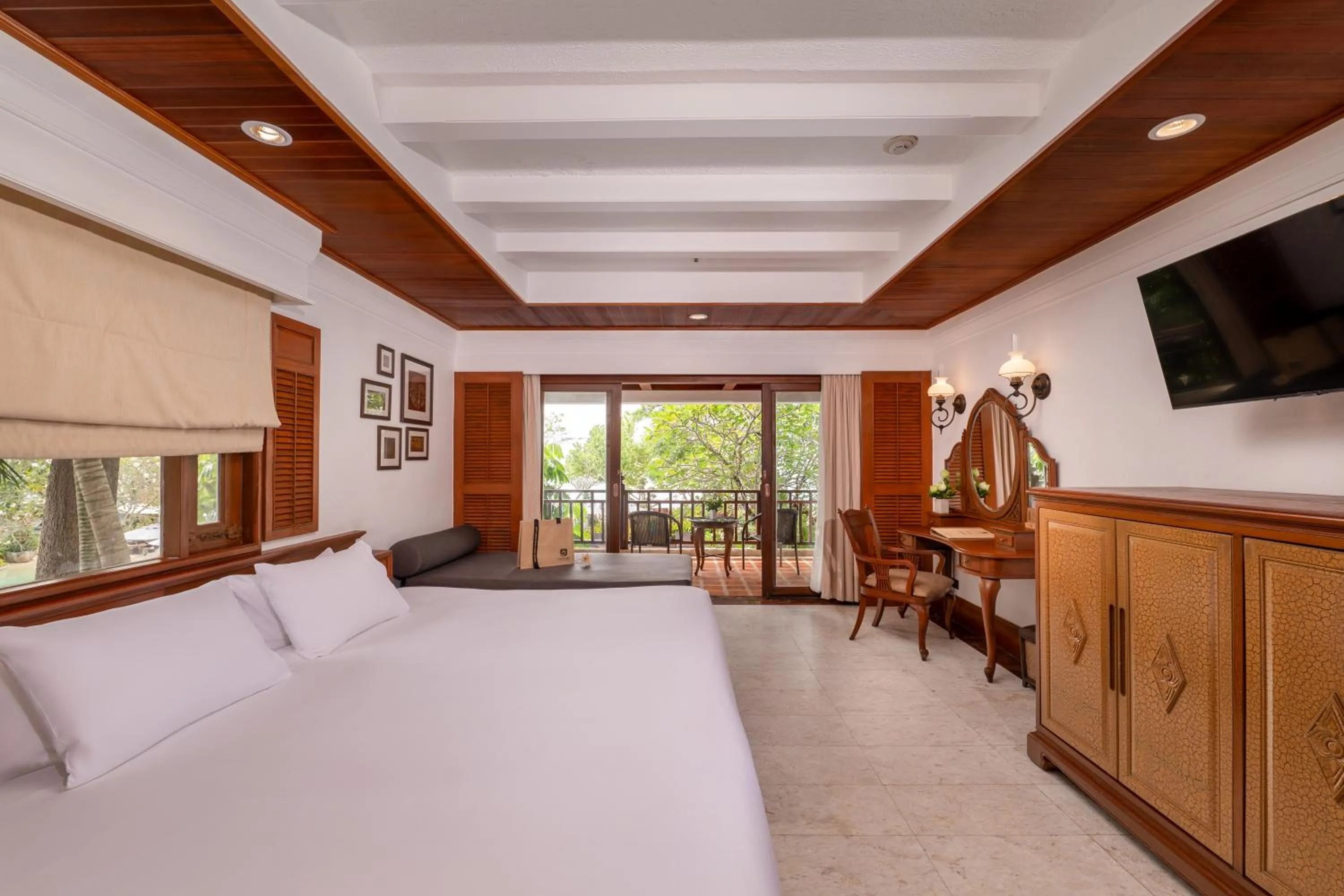 Bed in Thavorn Beach Village Resort & Spa Phuket