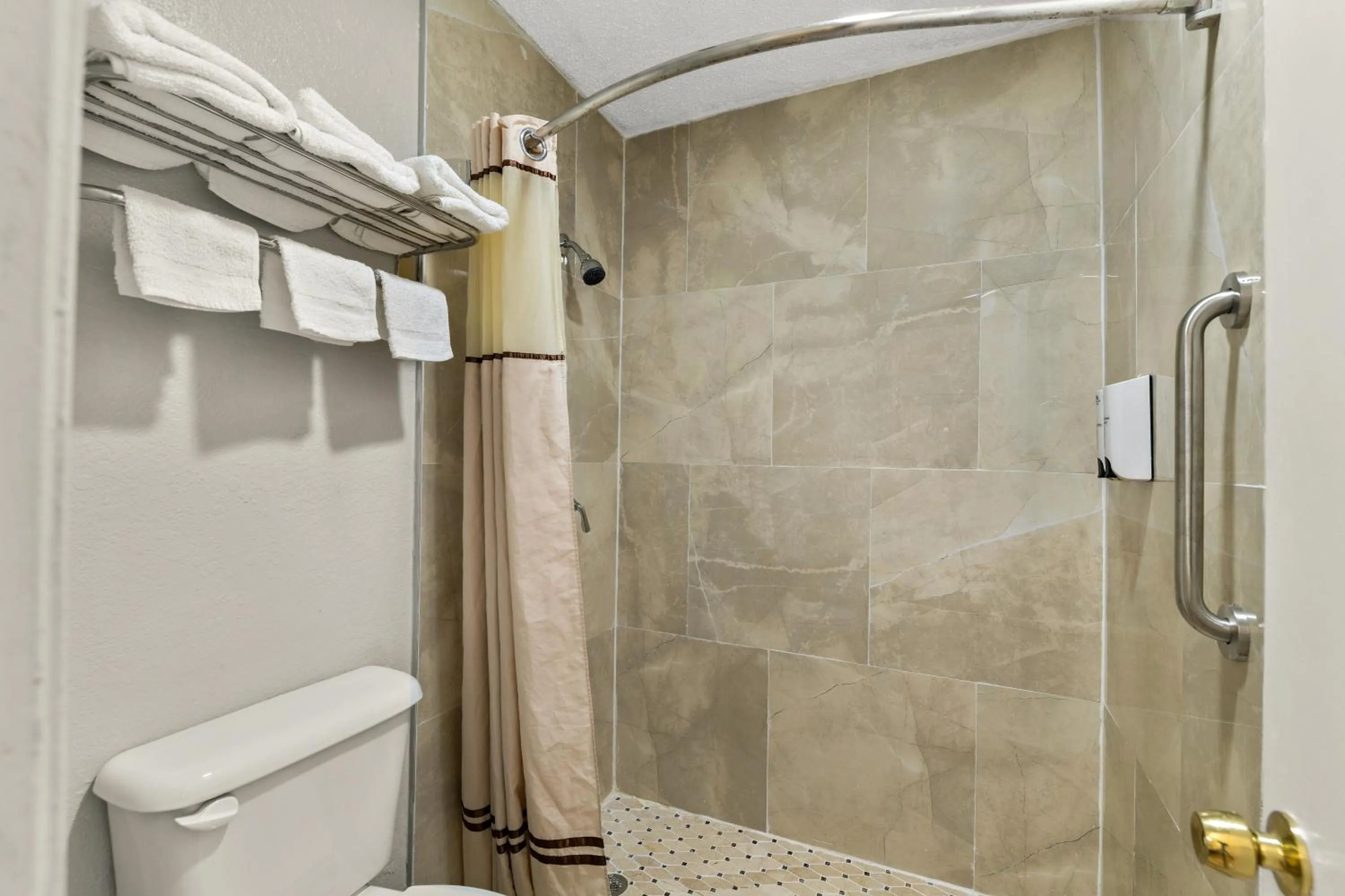 Shower in Americas Best Value Inn Bonham