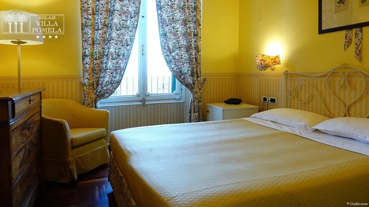 Bed in Relais Villa Pomela